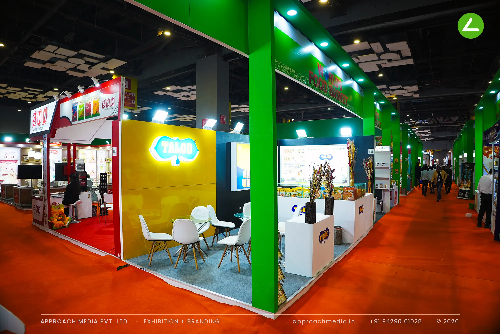 Talod exhibition stall design at Aahar New Delhi with a yellow laminate wall, halo-lit logo and branded food counters