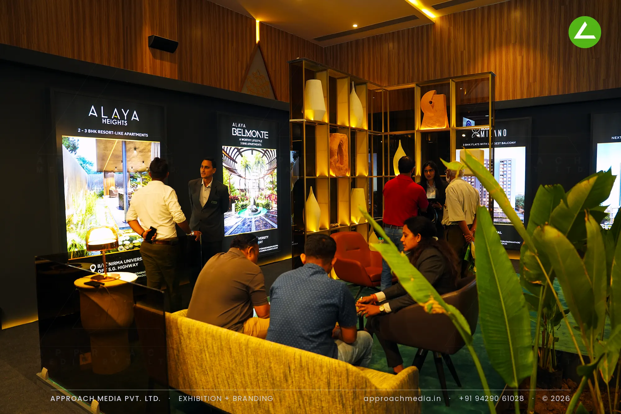 Mount exhibition stall design at Divya Bhaskar Property Show Ahmedabad with a lit brass display grid and wood walls
