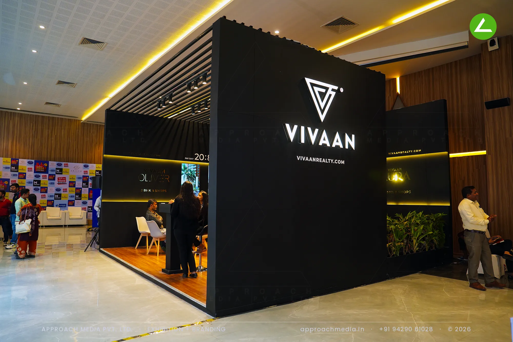 Vivaan exhibition stall design at Divya Bhaskar Property Show Ahmedabad: a matte black block with gold light bands