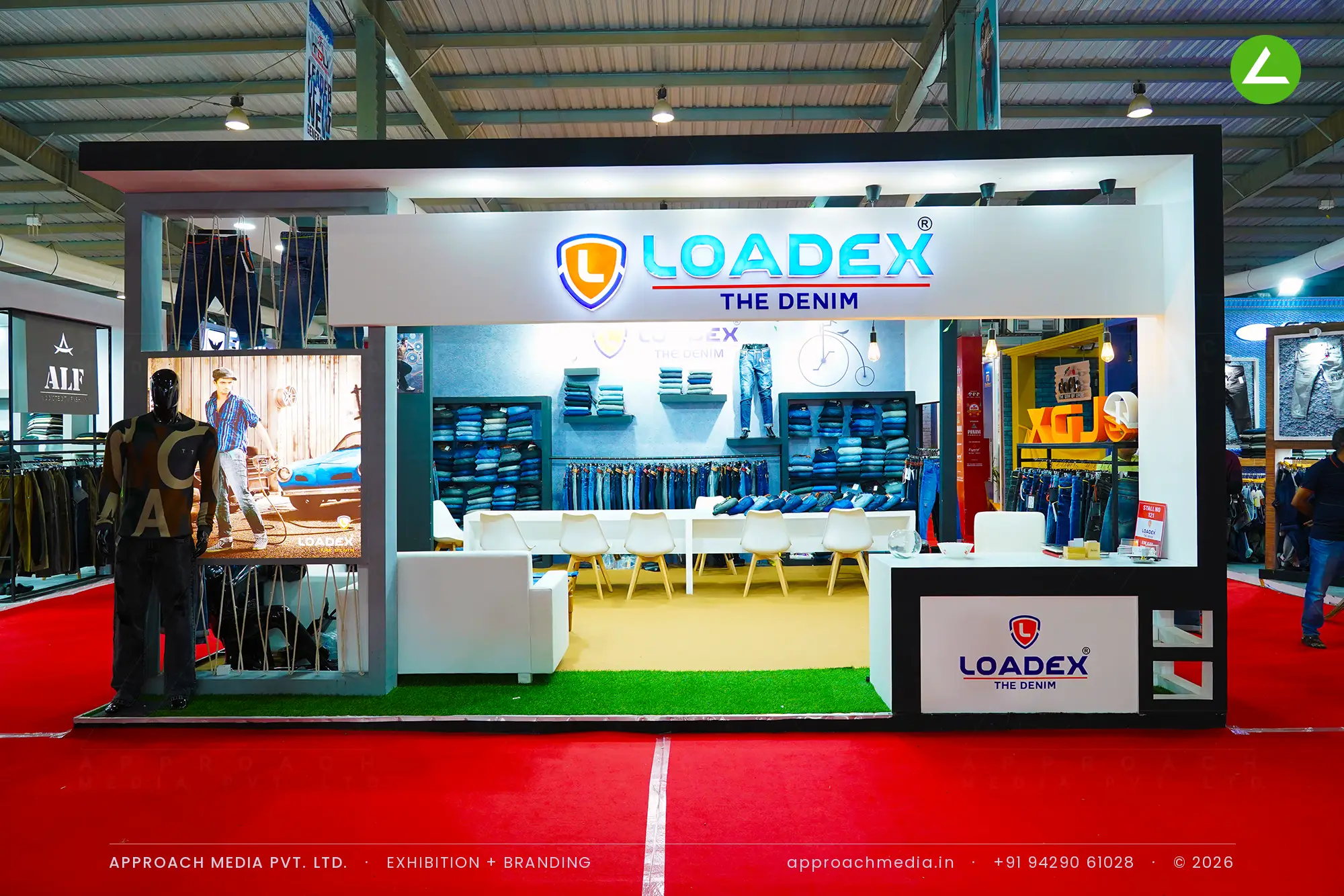 Loadex denim stall at the GGMA Garment Fair, with a black portal frame and an illuminated logo fascia over the aisle