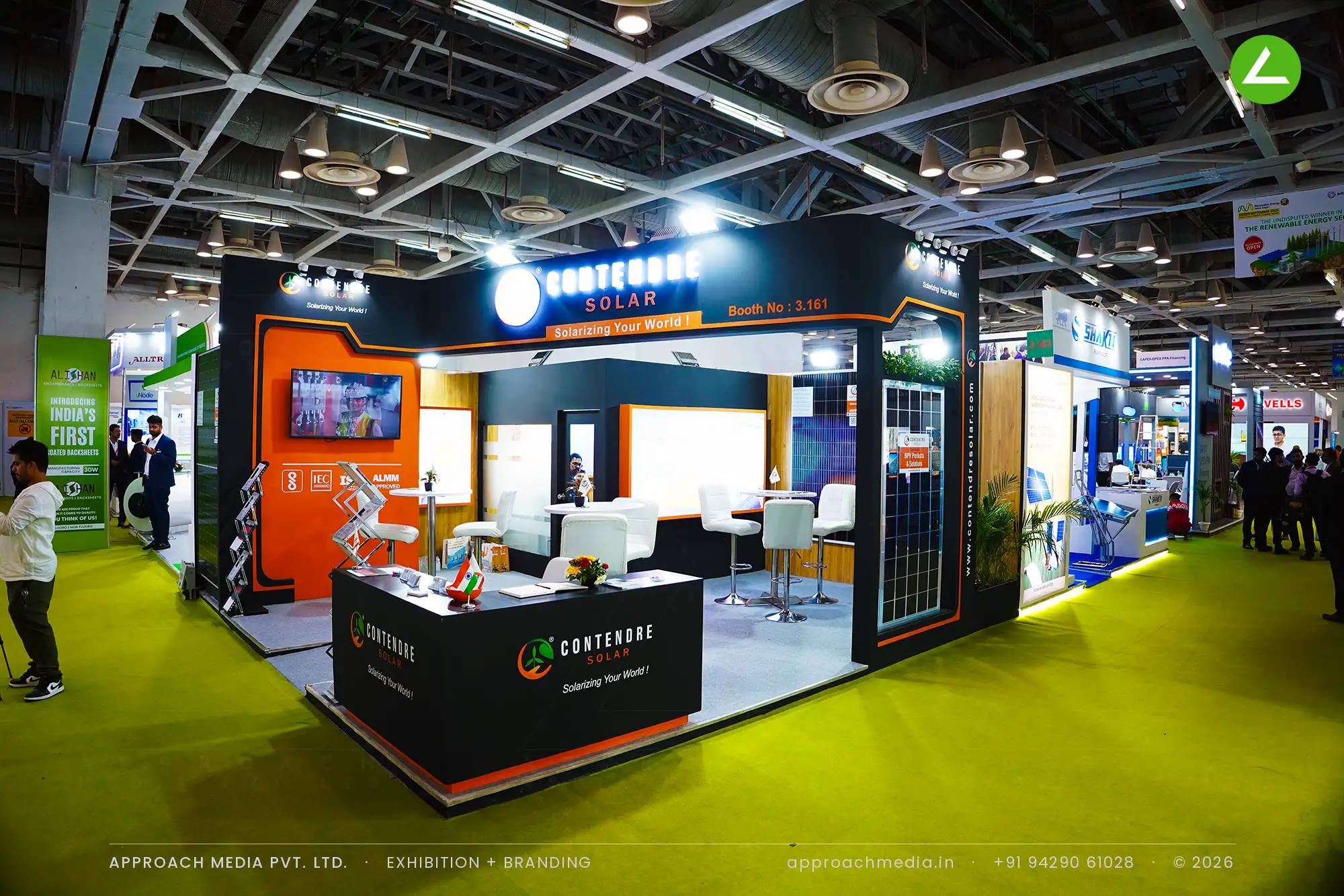 Contendre Solar's charcoal booth with orange trim and a backlit logo disc on the dark fascia, Greater Noida