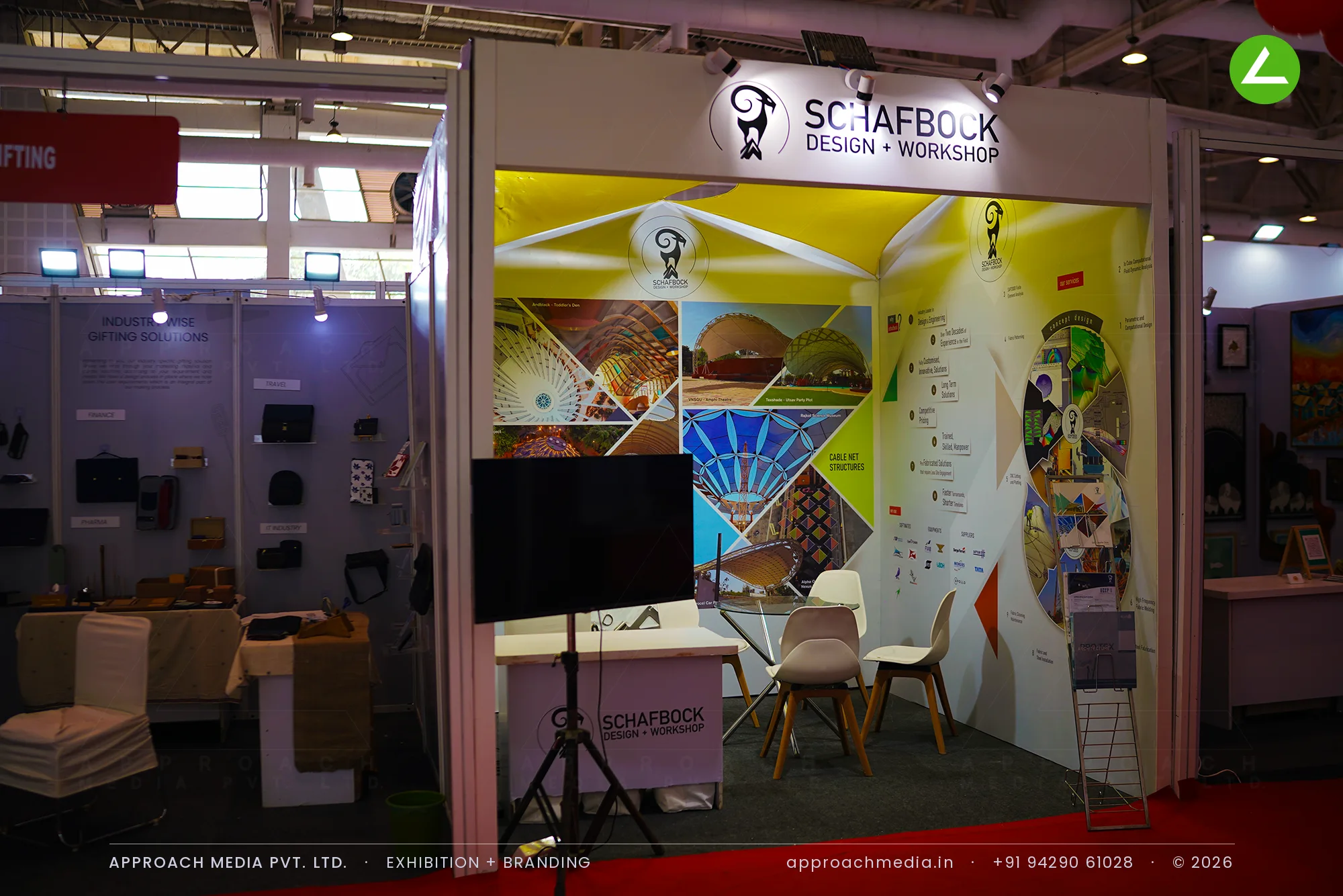 Schafbock exhibition stall design at BNI Symposium Gandhinagar with white tensile canopies over a yellow backlit wall