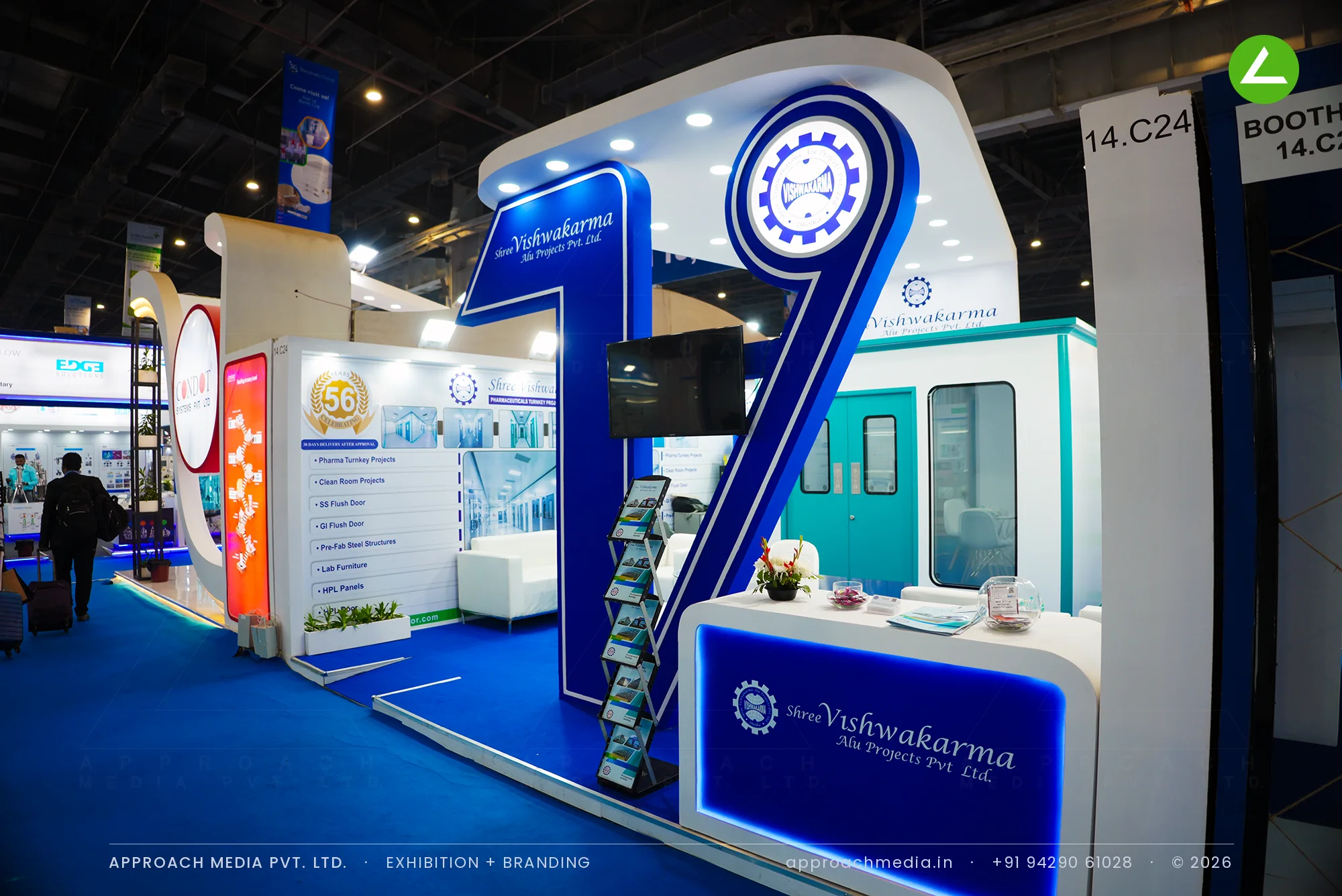 Shree Vishwakarma exhibition stall design at CPHI Greater Noida with blue sculpted numeral and clean-room flush doors