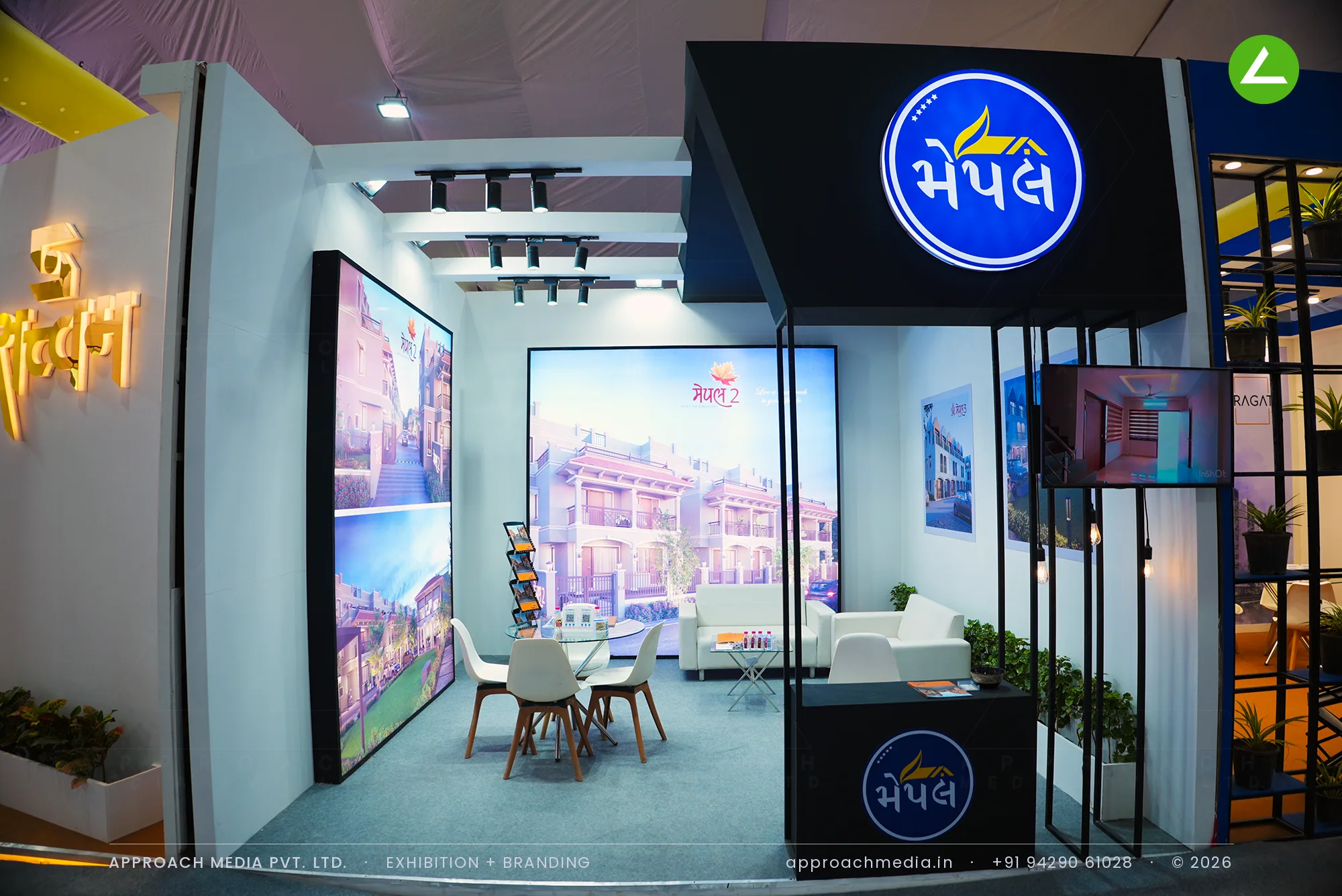 Maple exhibition stall design at Divya Bhaskar Property Show Narol Ahmedabad, black fascia with circular backlit logo