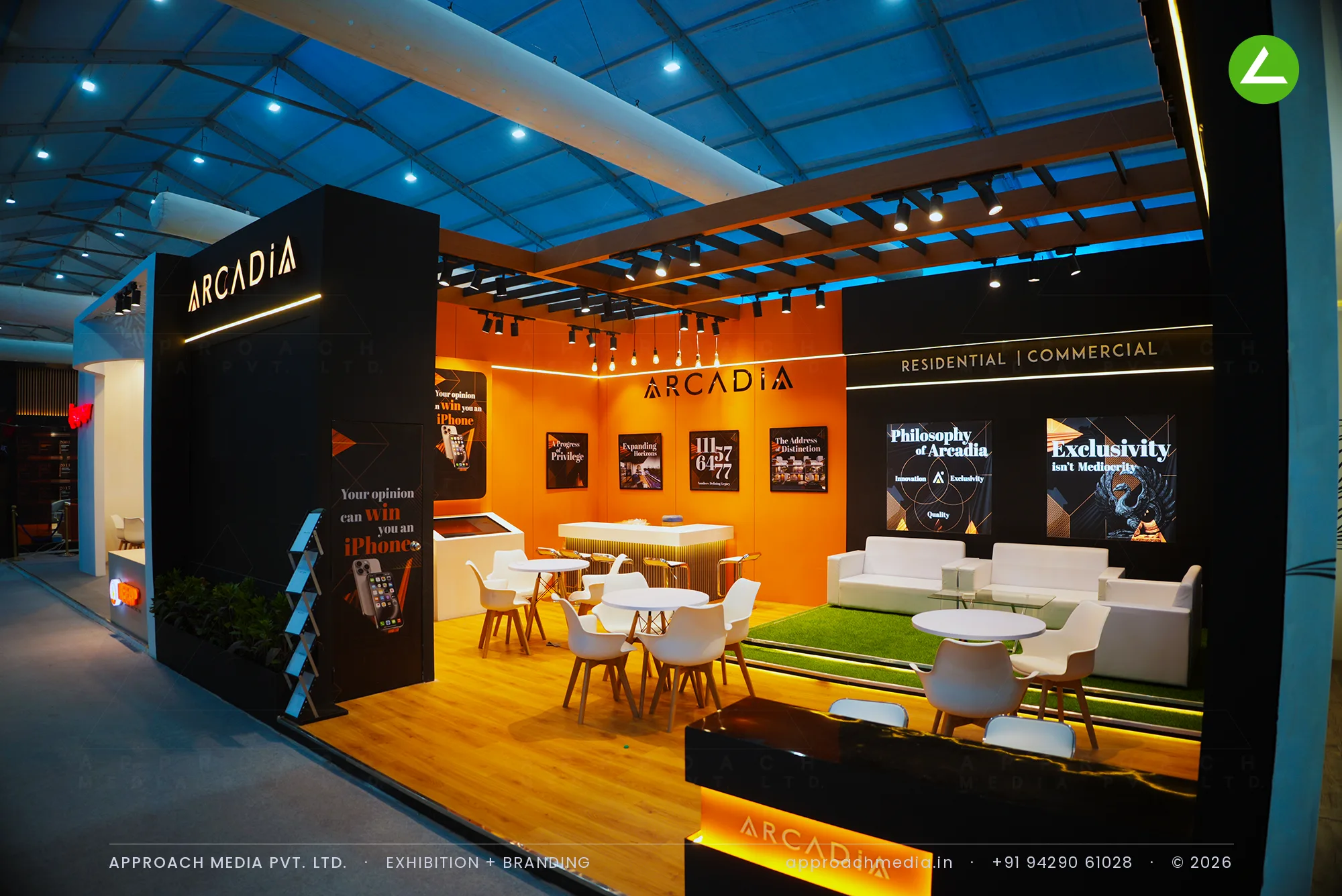 Arcadia exhibition stall design at NAREDCO Property Expo Ahmedabad, black gold-lined frontage and orange pergola lounge