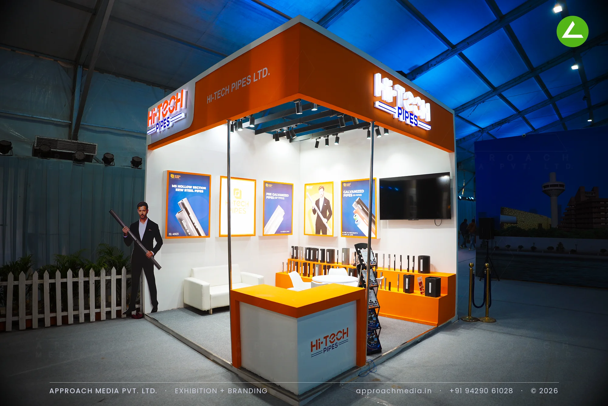 Hi-Tech Pipes exhibition stall design at NAREDCO Property Expo Ahmedabad with orange fascia and upright pipe samples
