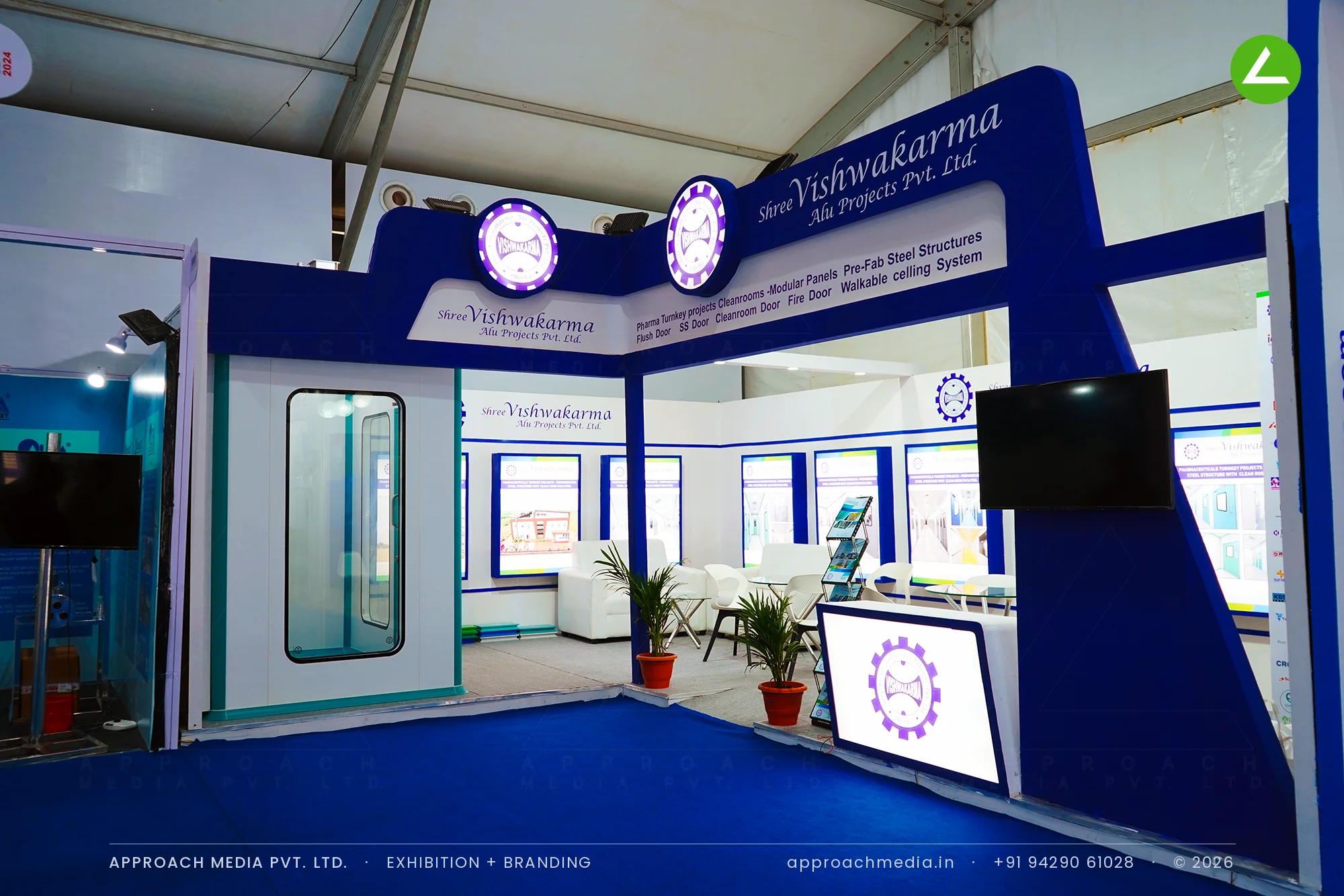 Shree Vishwakarma exhibition stall design at Pharma Pro Pack Hyderabad with a blue portal and cleanroom door mock-up