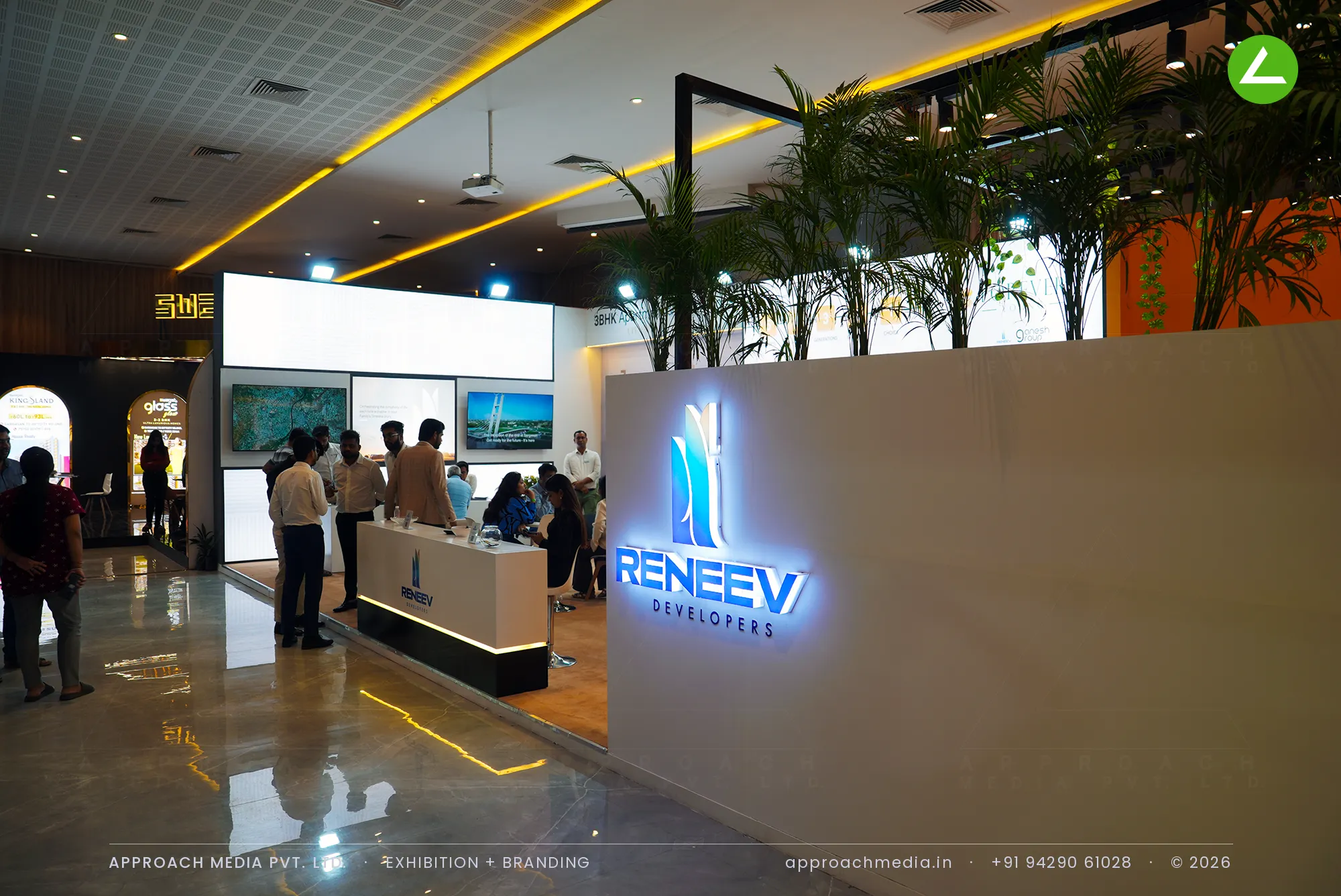Backlit Reneev Developers logo wall at the Forever Young exhibition stall design at Property Expo 2024