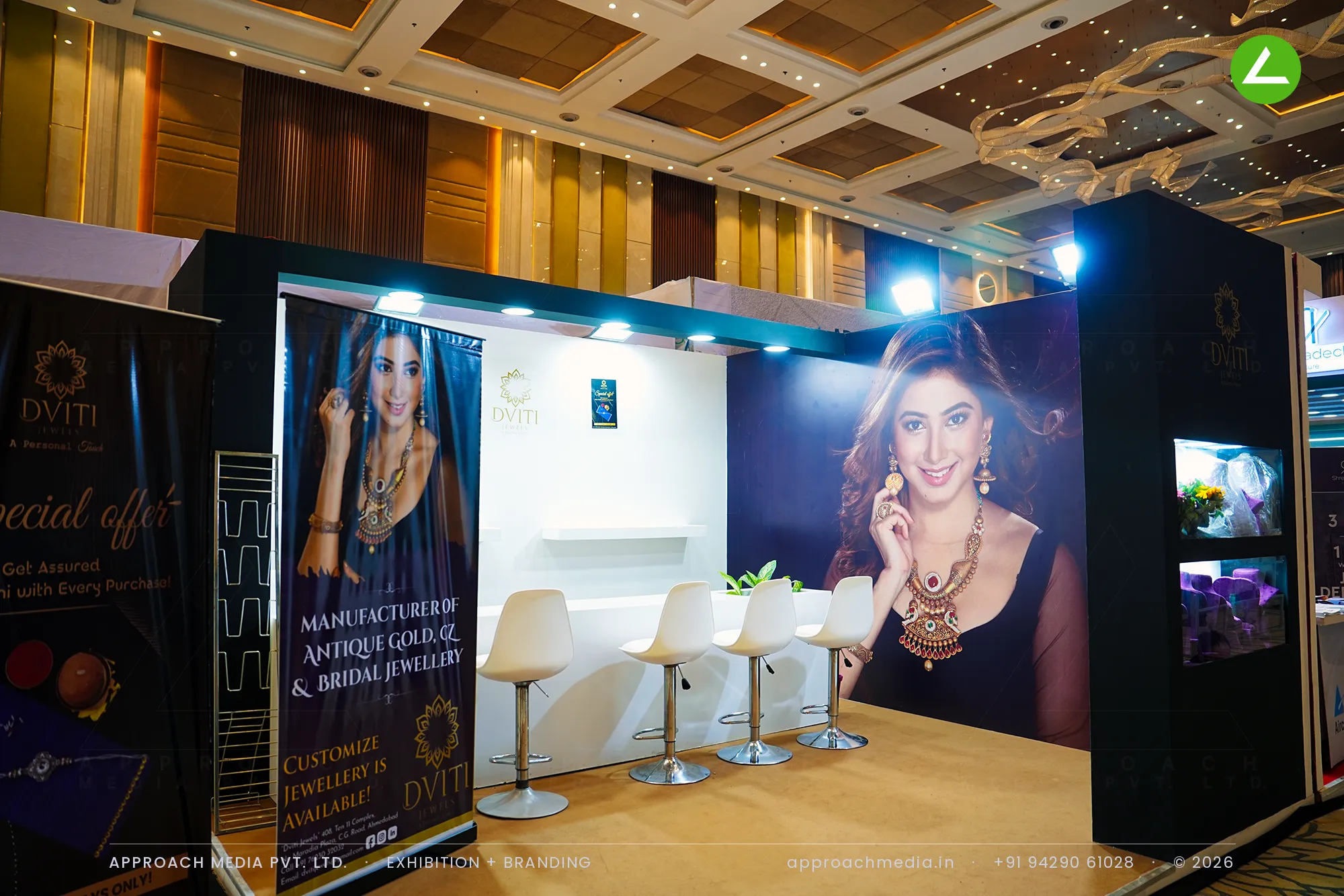 Navy panelled Dviti Jewels exhibition stall design at Vyapar Bazaar Ahmedabad with a lit jewellery vitrine