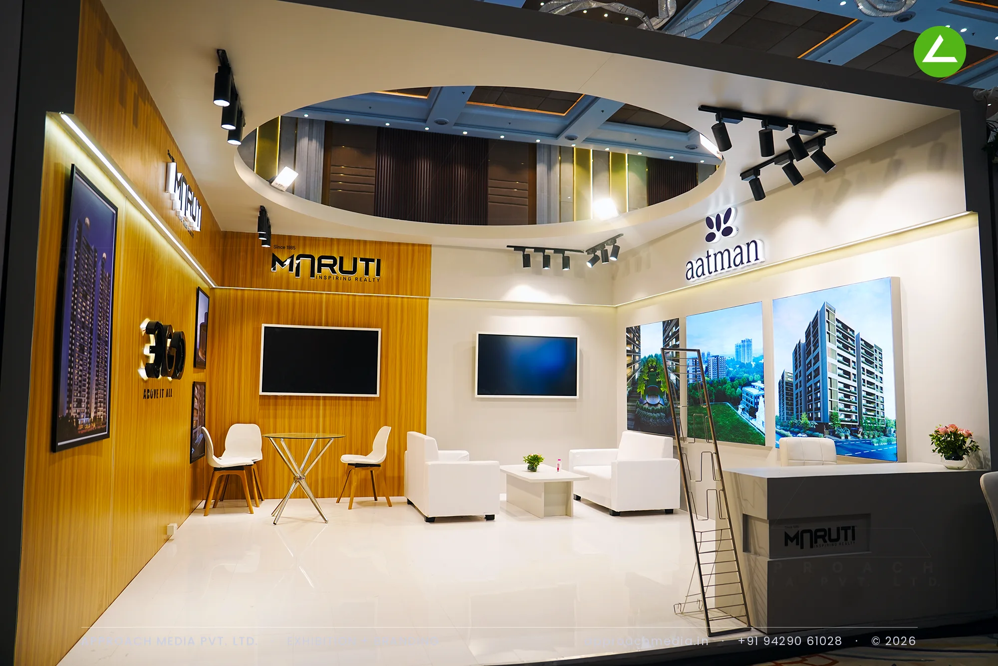 Teak brand wall and oval cove-lit ceiling at the Maruti Aatman 360 exhibition stall design at Vyapar Bazaar Ahmedabad