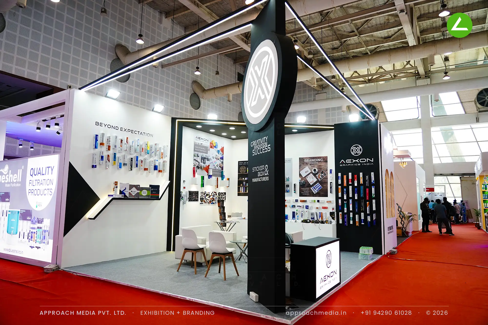 Black and white exhibition stall design at WAPTAG Water Expo Gandhinagar for Aexon Graphics India with a lit corner tower