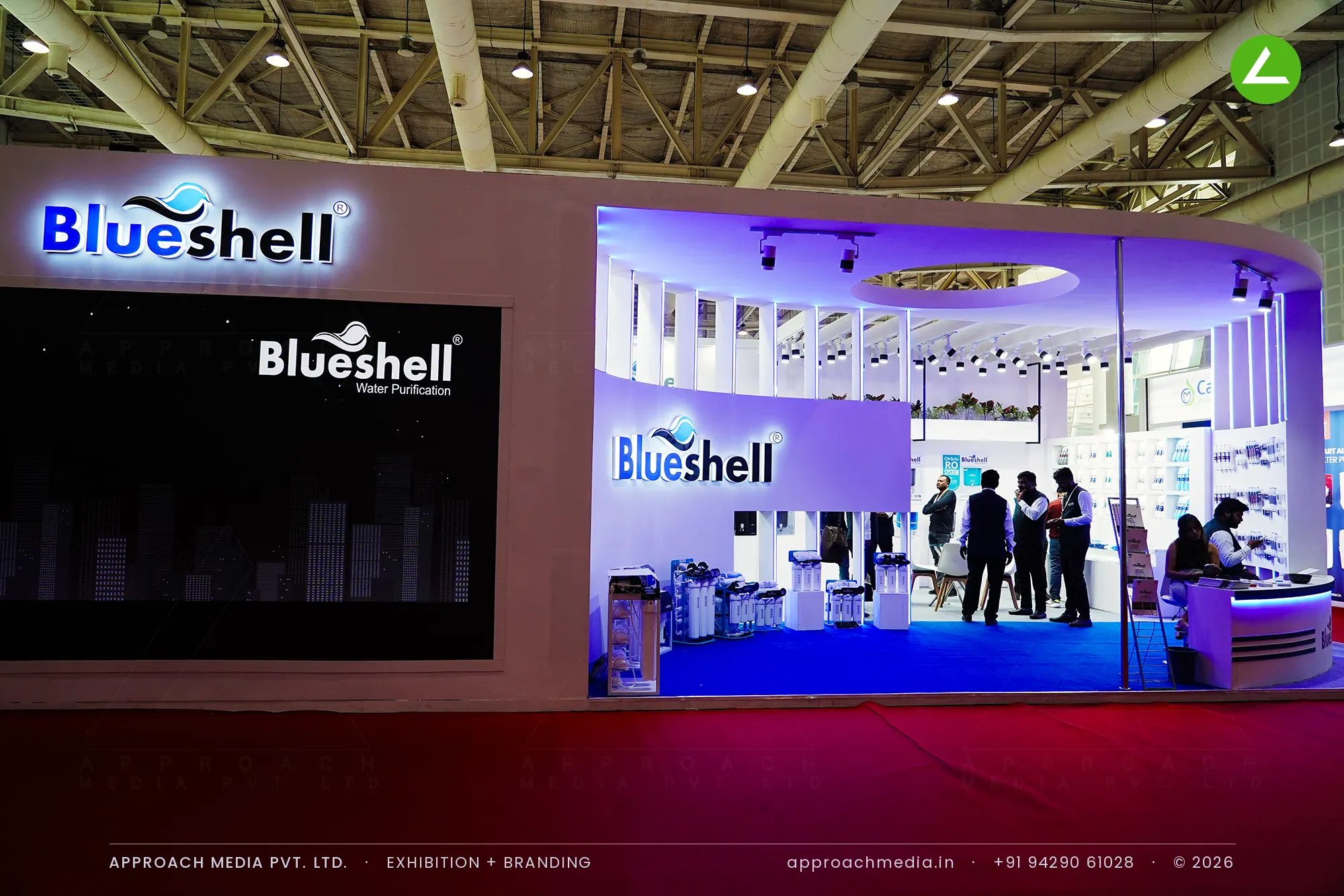 Blueshell exhibition stall design at WAPTAG Water Expo Gandhinagar with an LED video wall and violet-lit curved interior