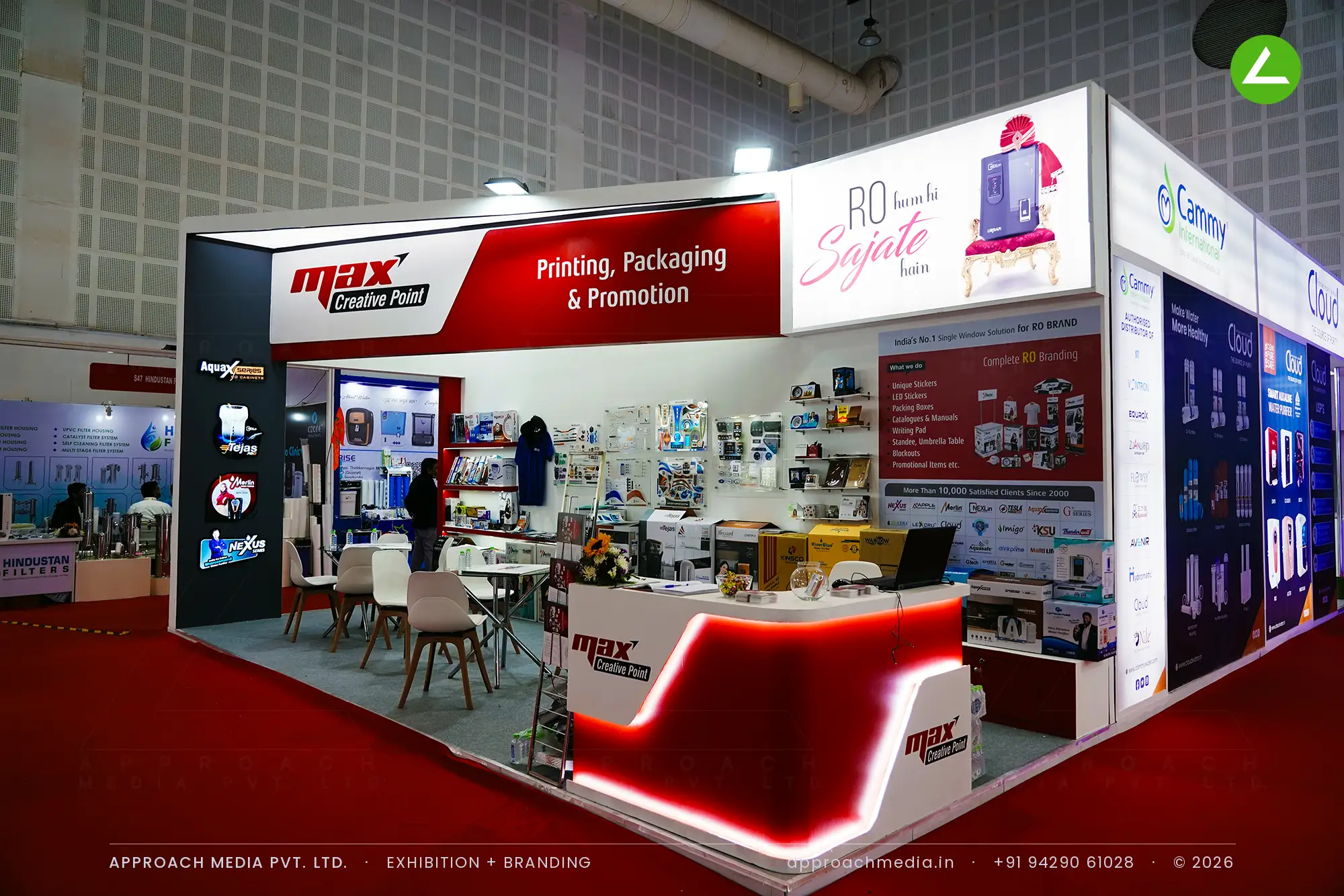 Max Creative Point exhibition stall design at WAPTAG Water Expo Gandhinagar with a red LED-lit curved counter