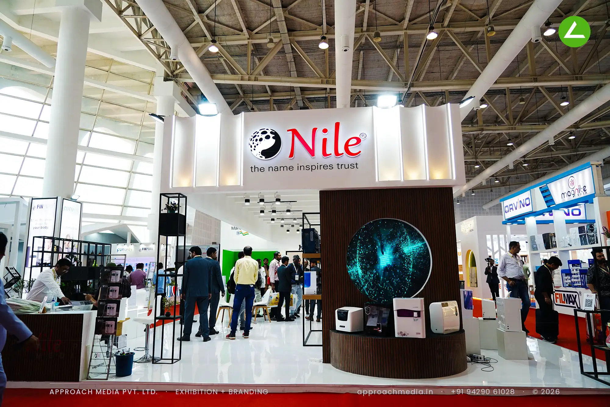 Nile exhibition stall design at WAPTAG Water Expo Gandhinagar with a walnut-slat drum and a circular LED screen