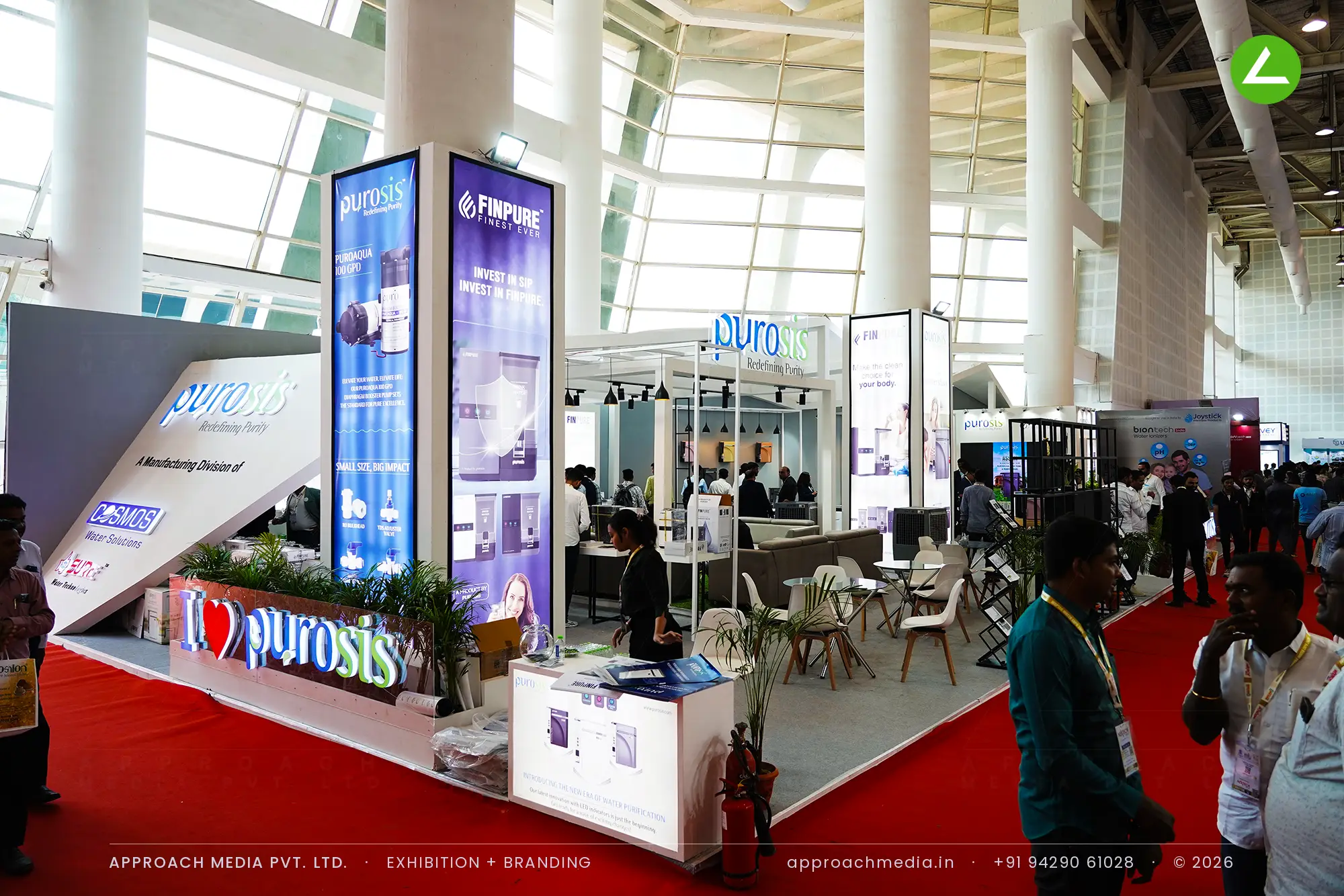 Purosis exhibition stall design at WAPTAG Water Expo Gandhinagar with open white gable frames, and backlit totems