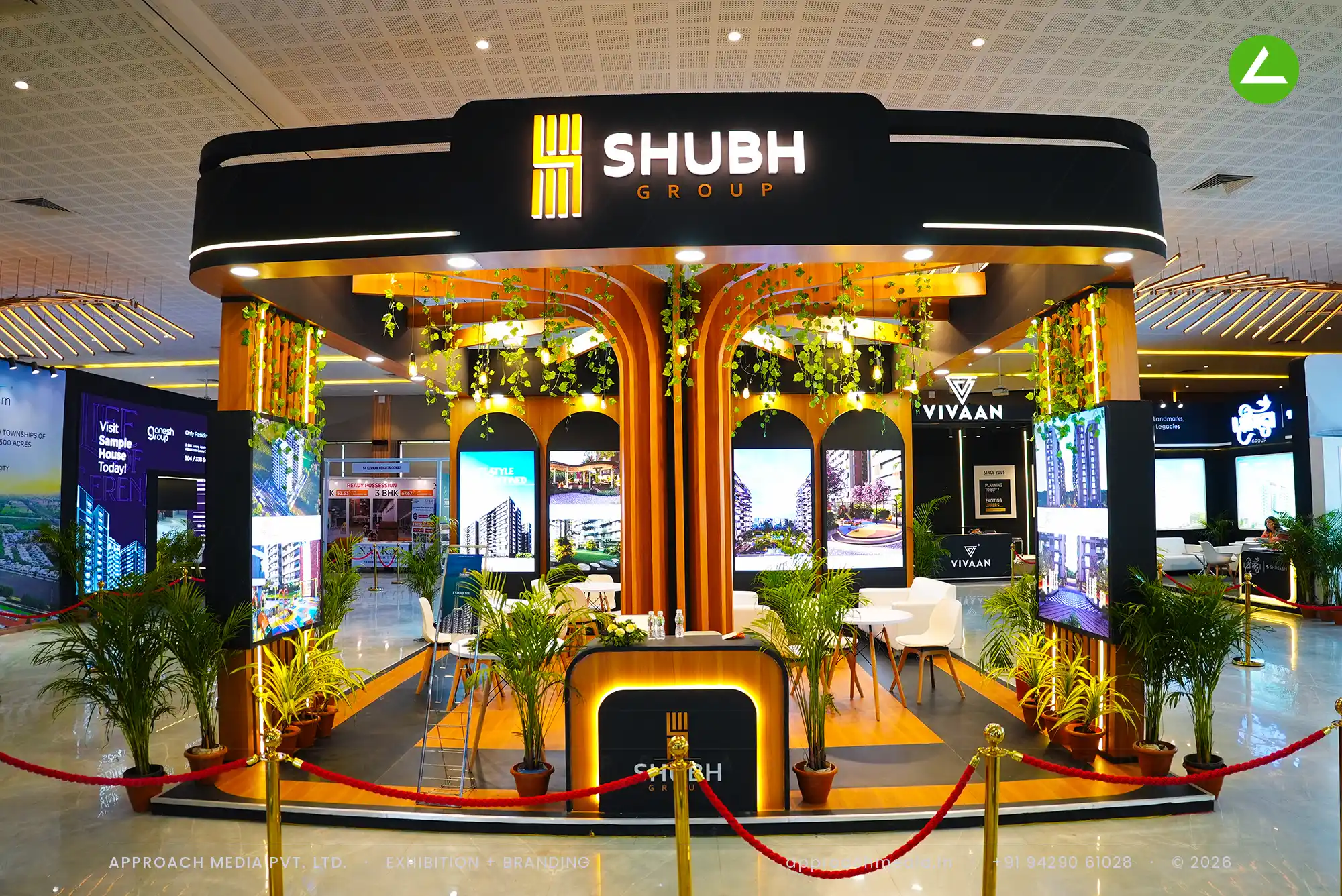 Shubh Aalayam's timber arches and pergola beams hung with creeper vines and warm bulbs under a black fascia ring