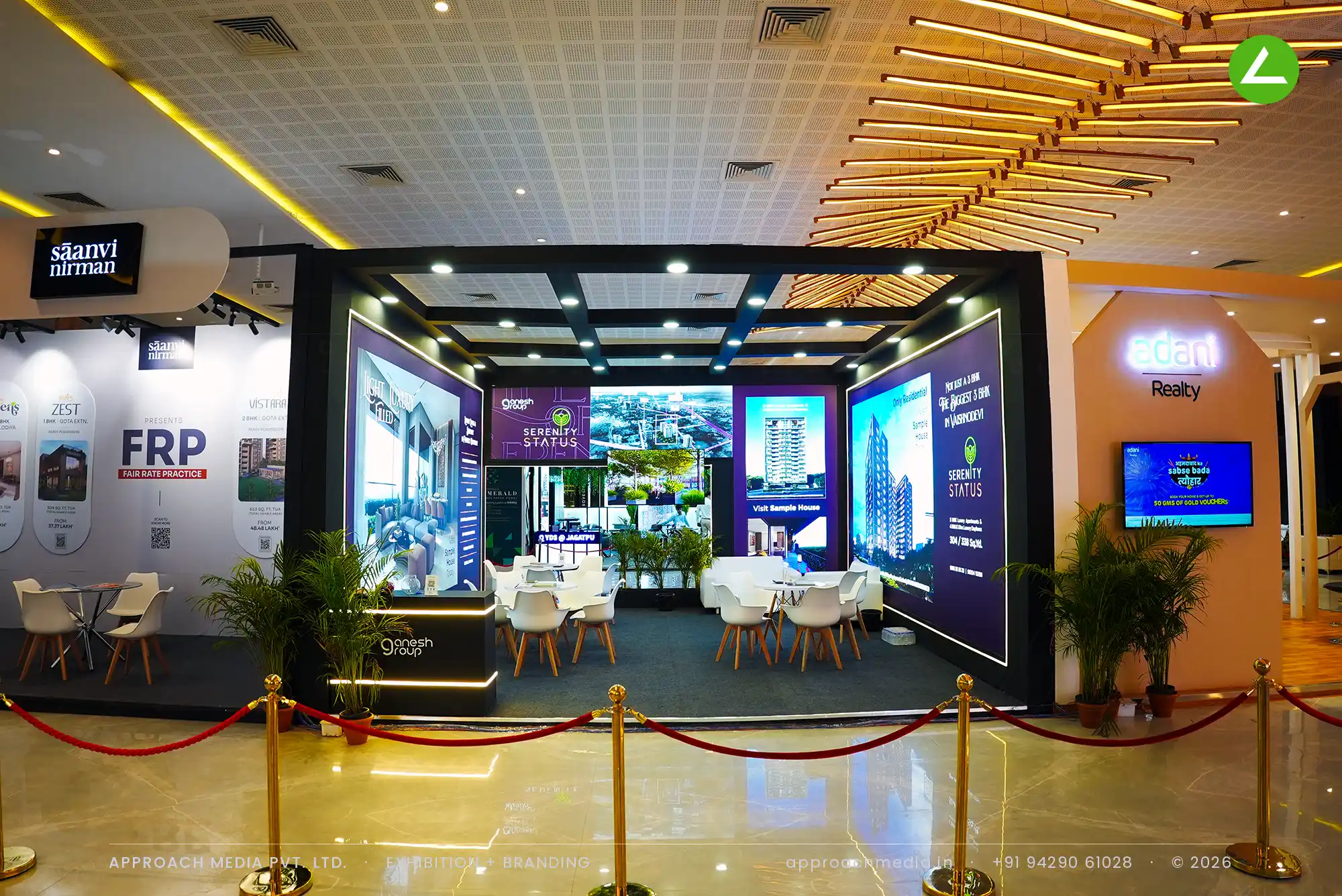The Ganesh Group's backlit purple project walls edged in white LED, under a black coffered ceiling grid