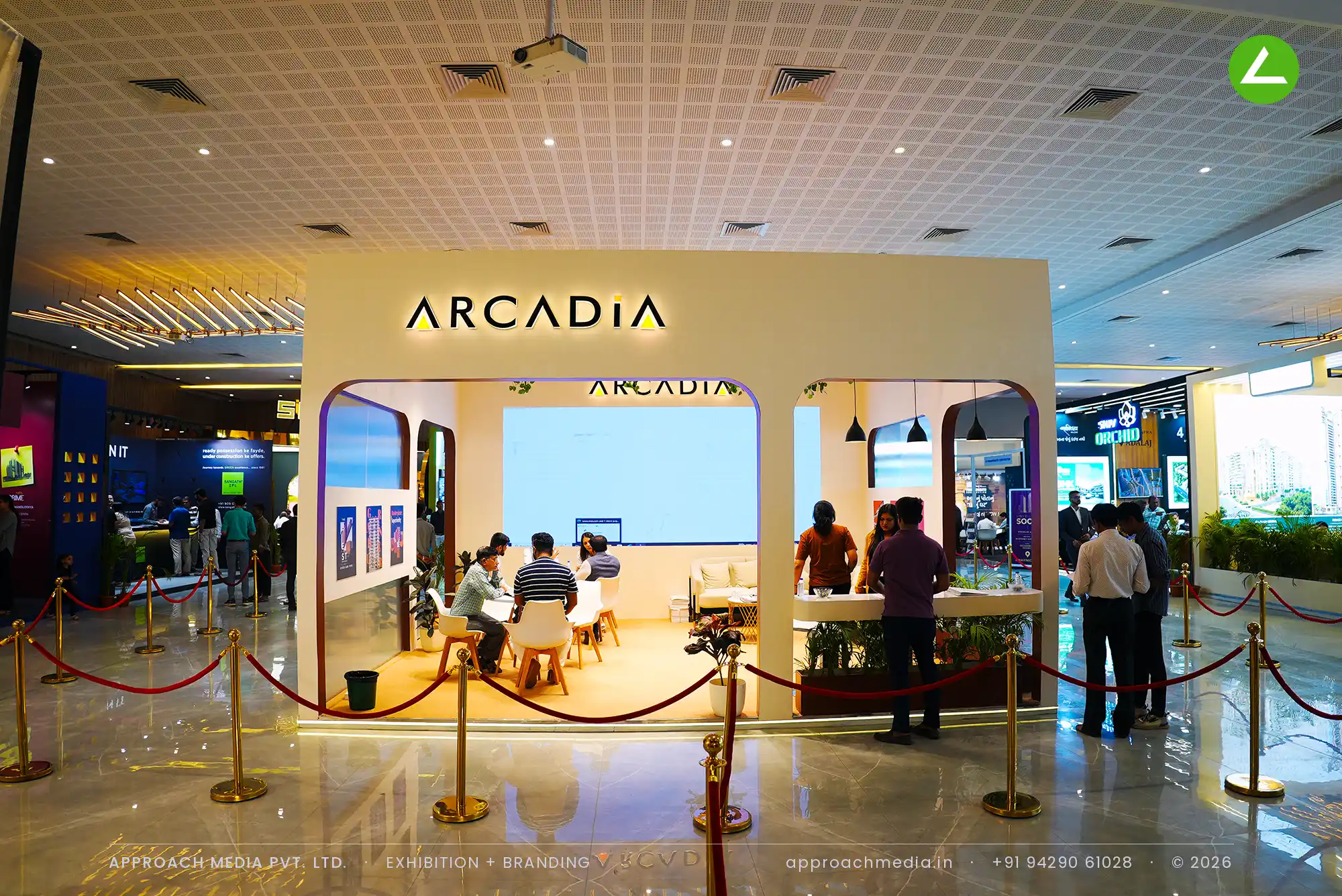 Arcadia's cream arched bays and fanned batten ceiling with trailing vines, around a large LED video wall
