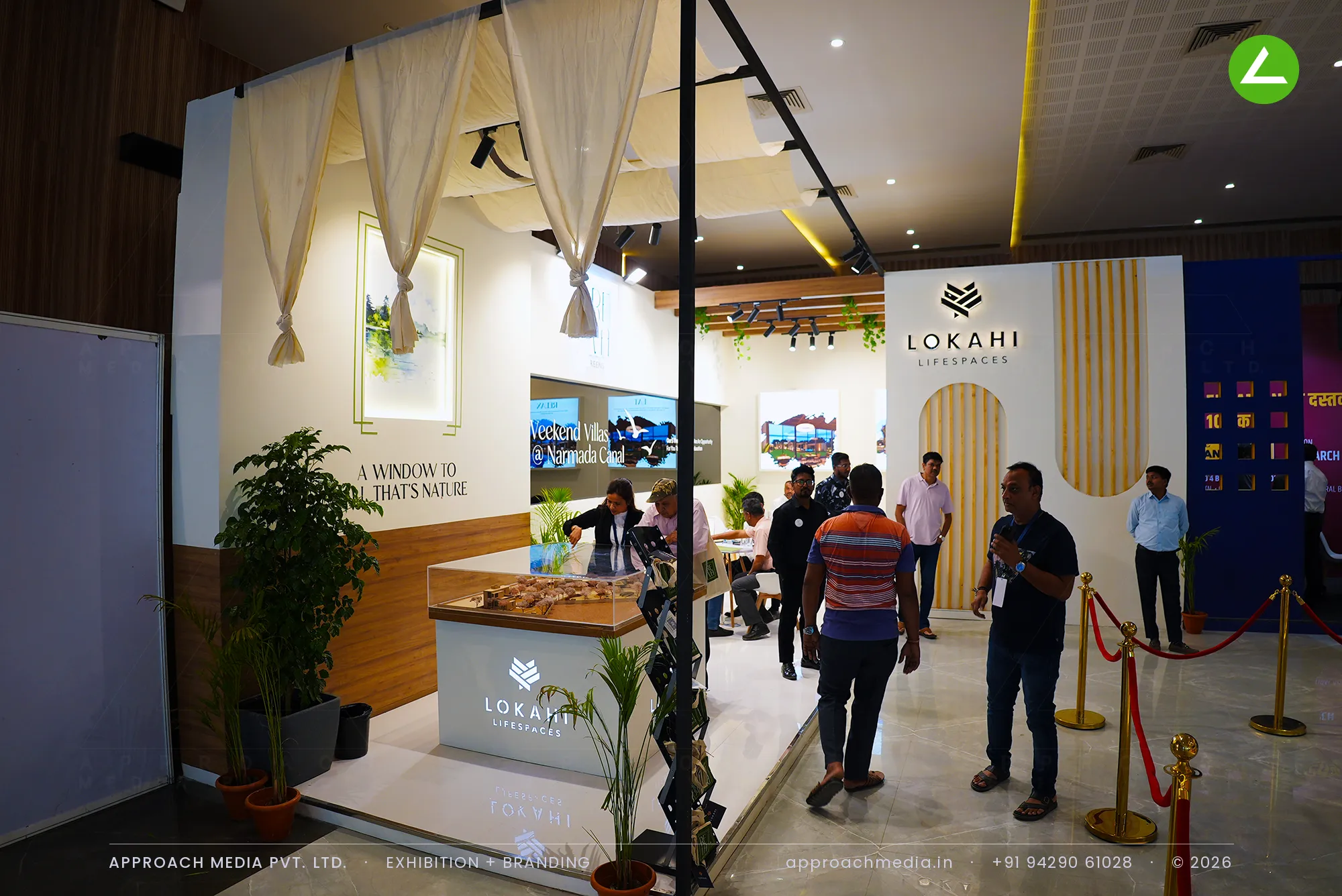 Lokahi Lifespaces exhibition stall design at Ahmedabad Mirror Property Expo, Ahmedabad, with draped ceiling and villa model