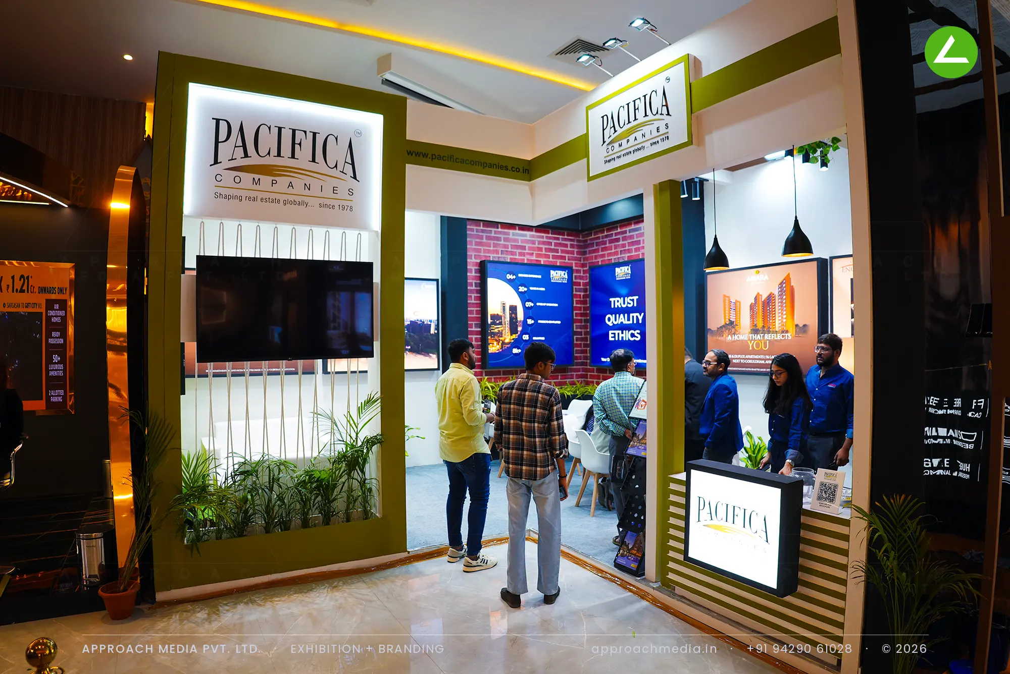 Pacifica Companies exhibition stall design at Ahmedabad Mirror Property Expo, Ahmedabad, with lit logo portal and screens