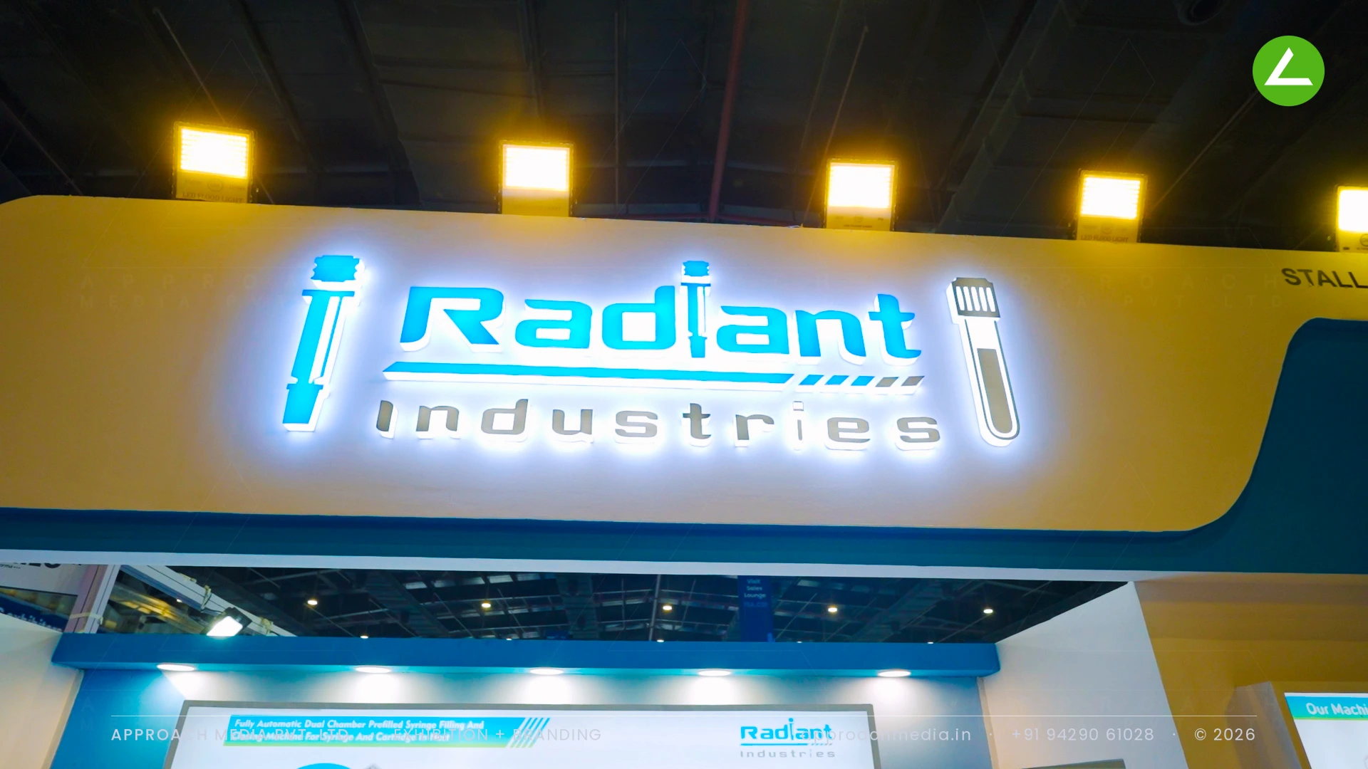 Radiant Industries exhibition stall design at CPHI Greater Noida, built around a live filling line — photo 2