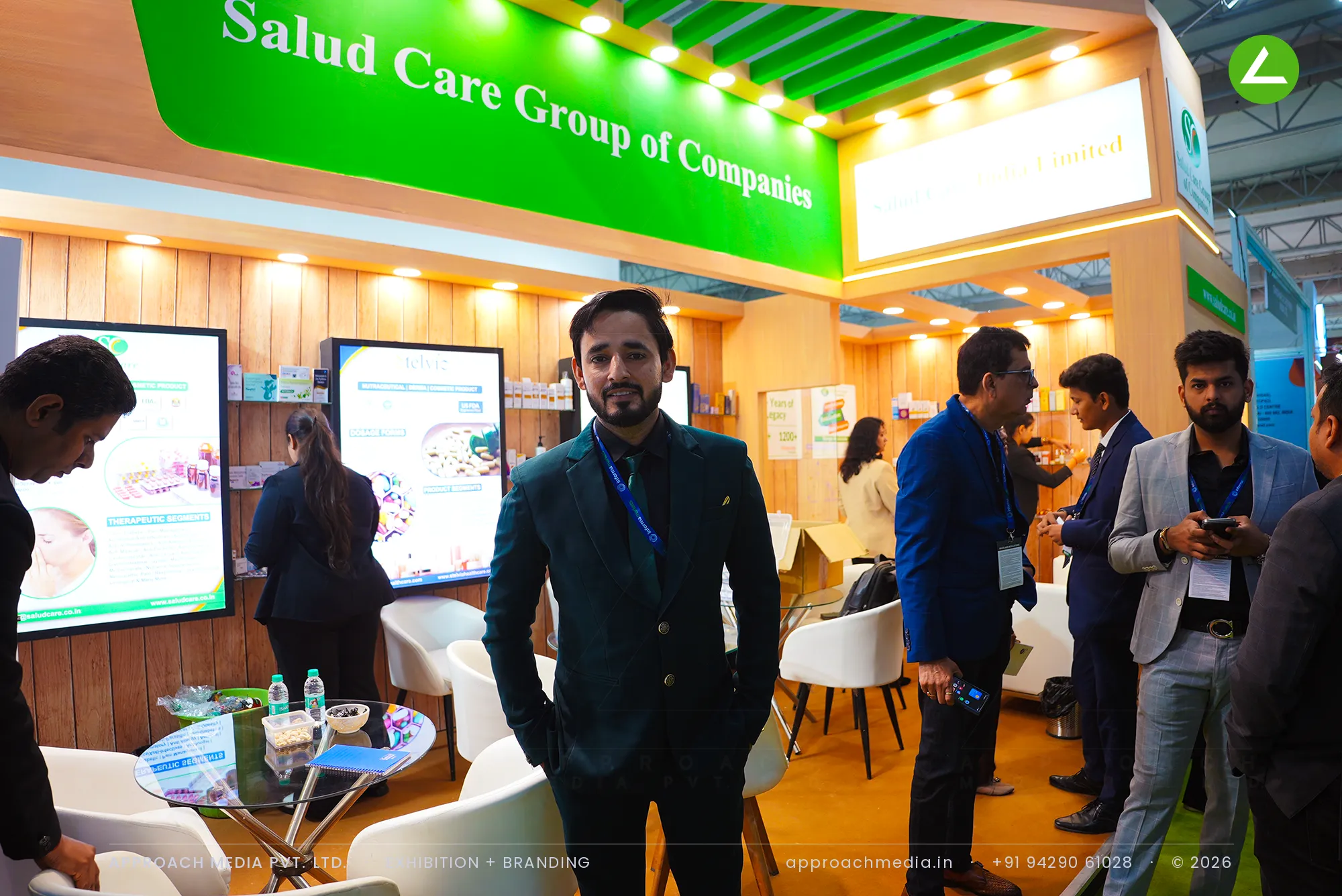 Wood and green for Salud Care Group: exhibition stall design at CPHI Greater Noida — photo 2