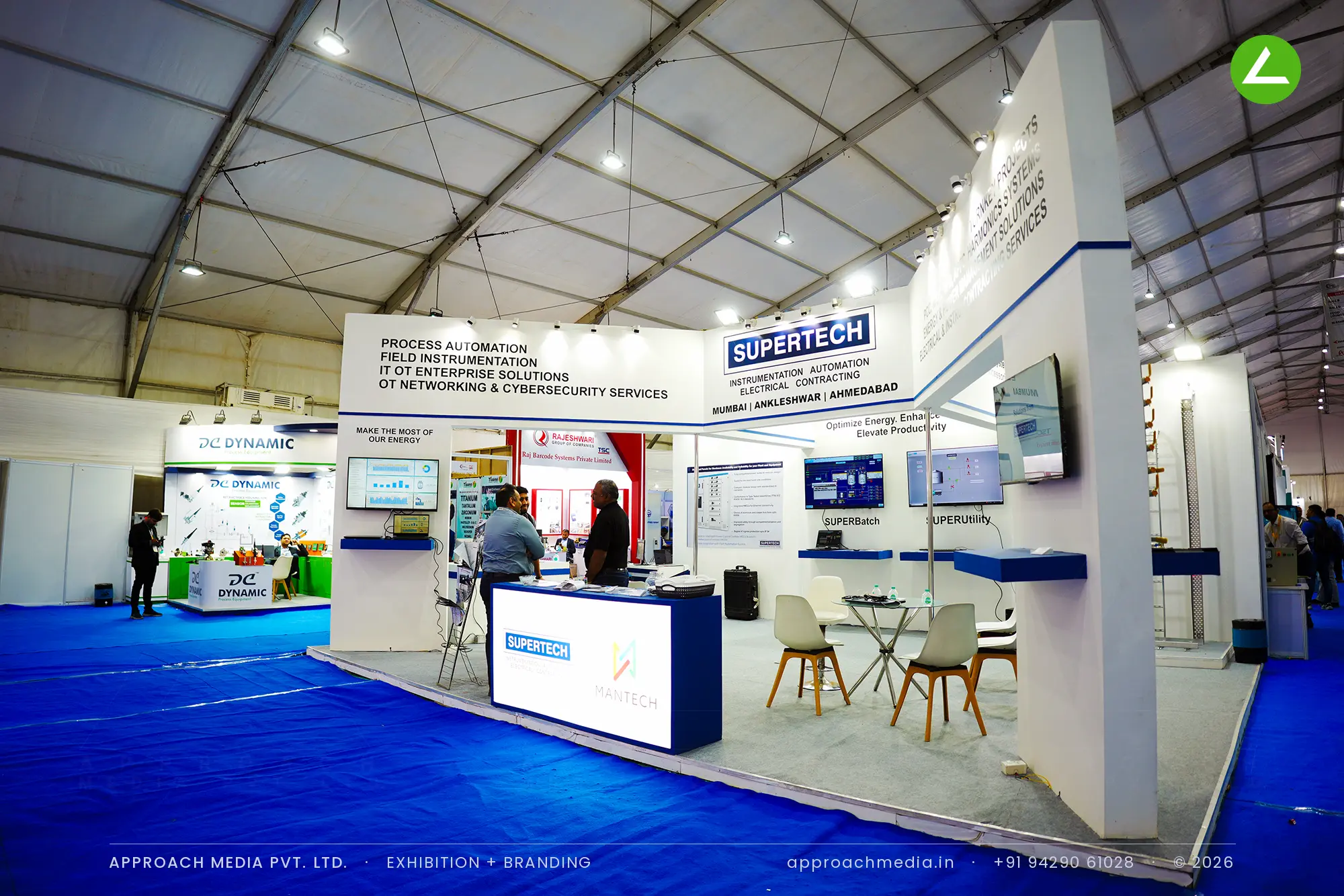 Supertech white and navy exhibition stall design at Dahej Industrial Expo Bharuch, three sides open with live demo screens