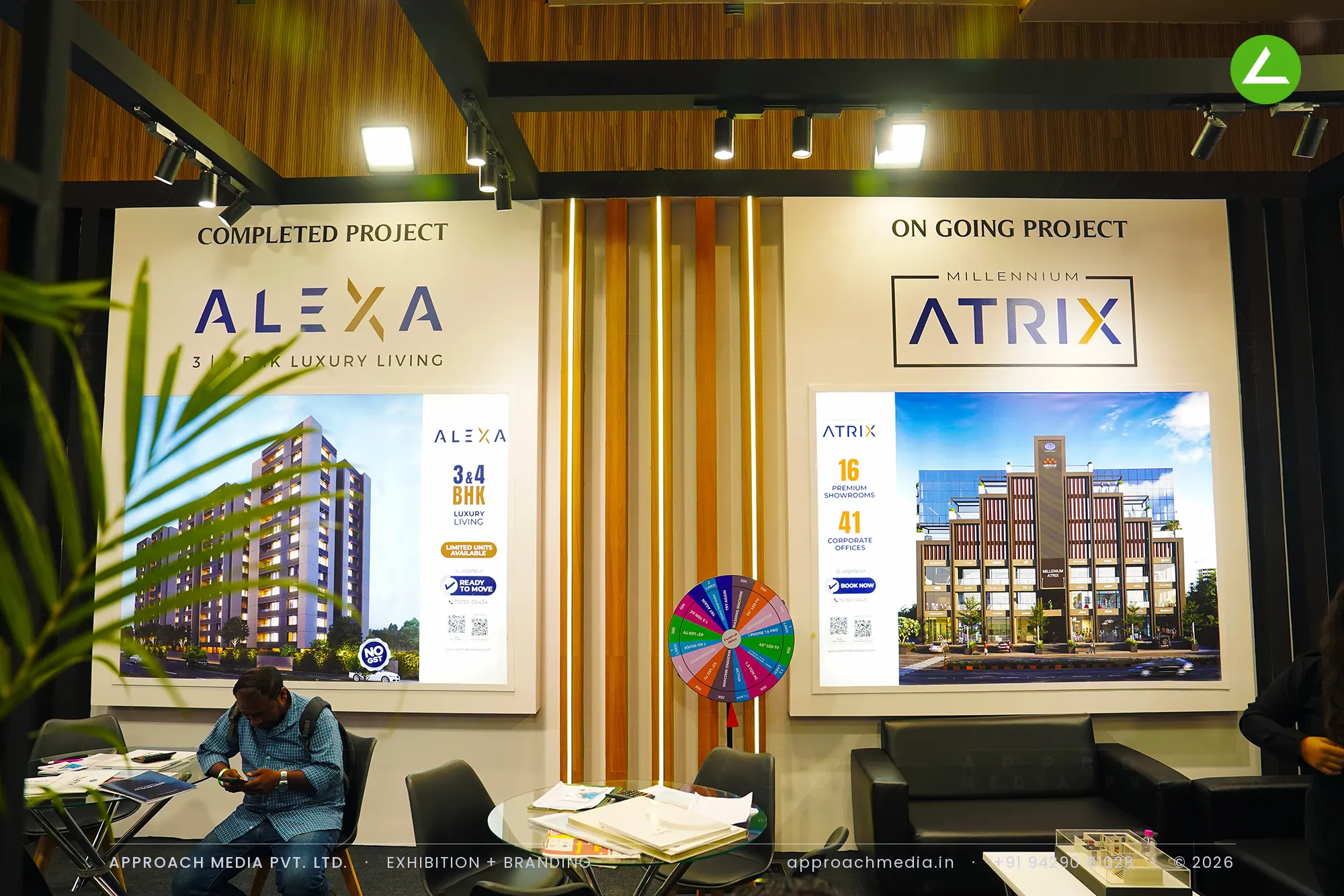 LD - Laxmi Developers: dark timber exhibition stall design at Divya Bhaskar Property Expo Ahmedabad — photo 3