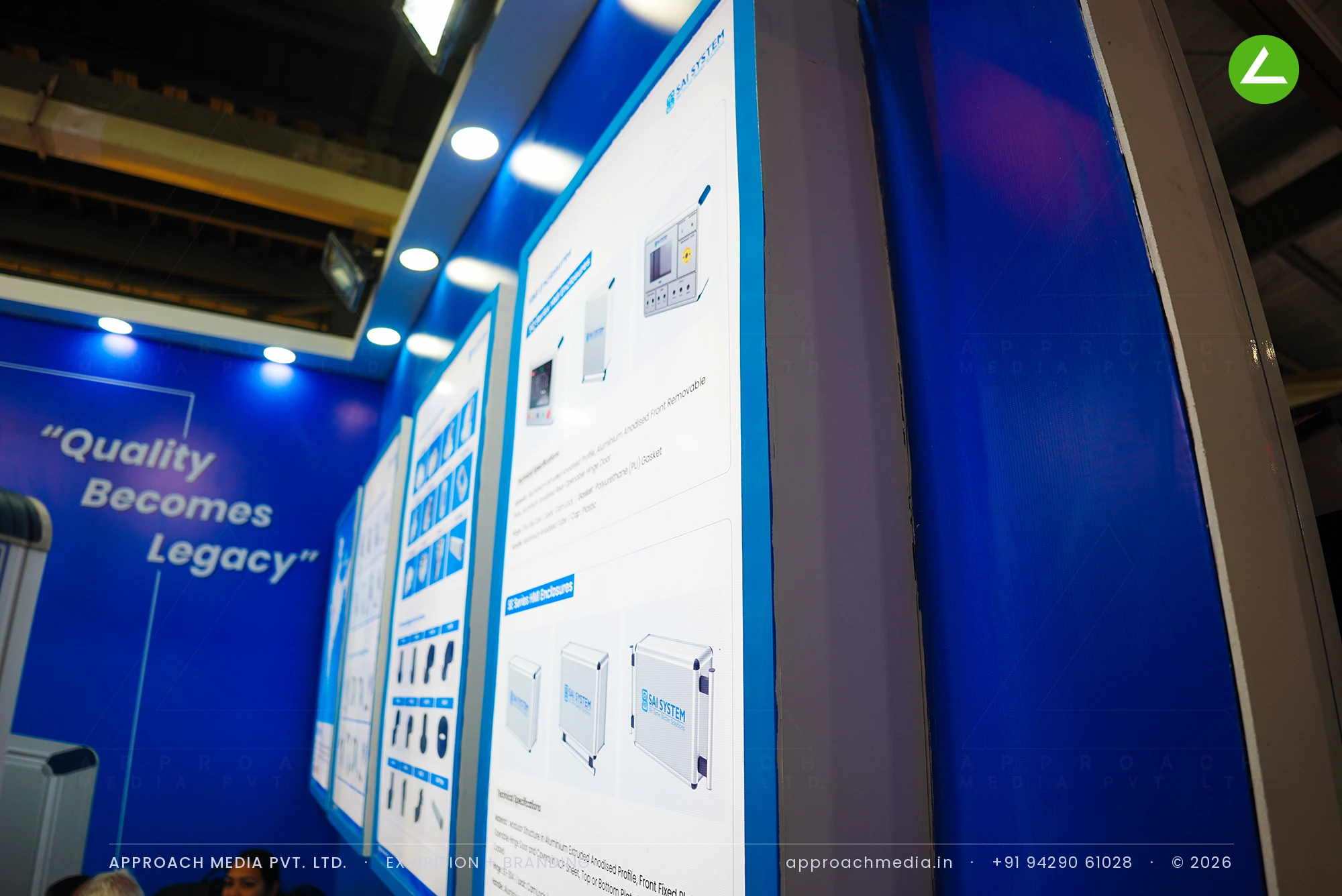 Sai System — blue exhibition stall design at EngiMach Gandhinagar with live support-arm demos — photo 3