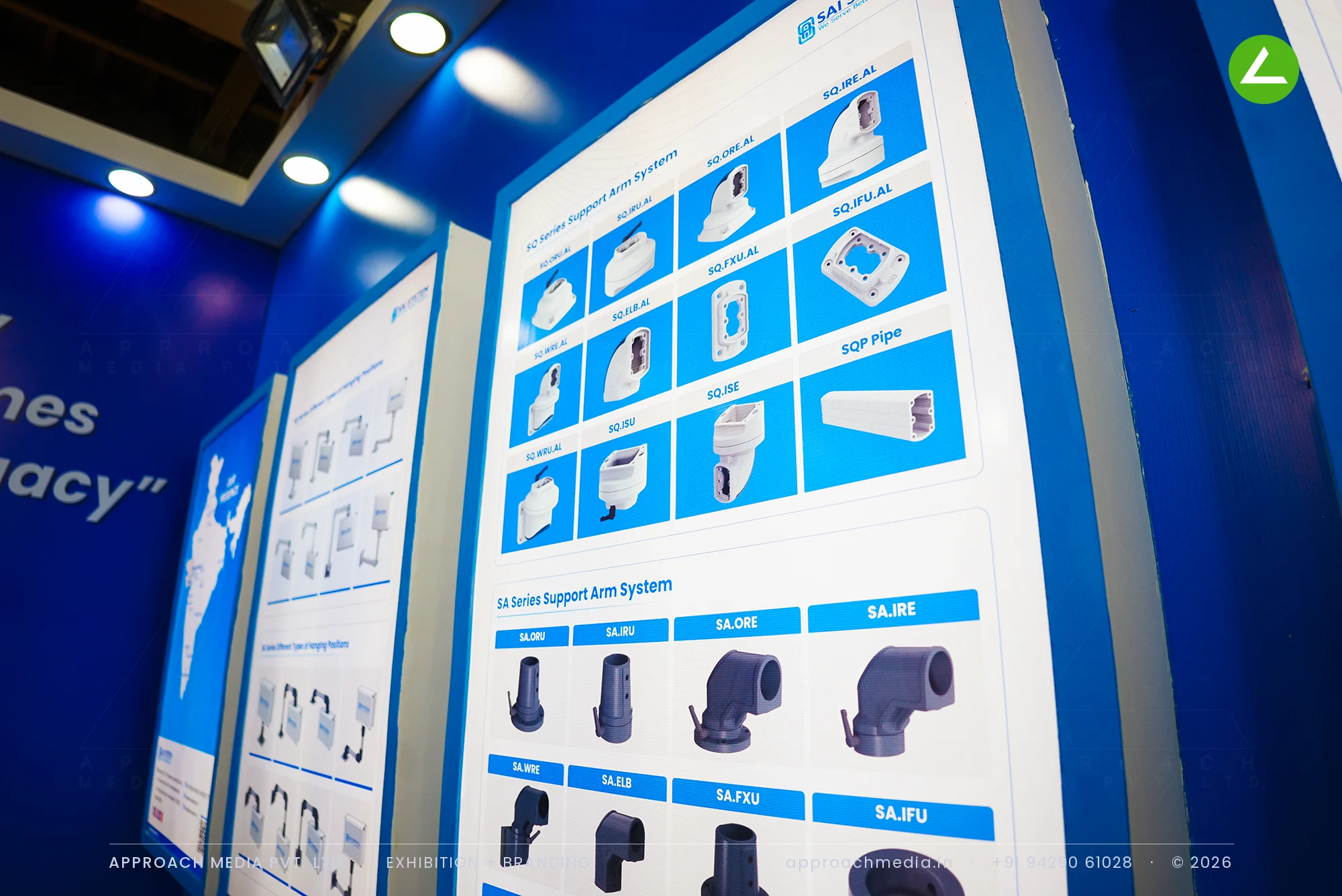Sai System — blue exhibition stall design at EngiMach Gandhinagar with live support-arm demos — photo 4