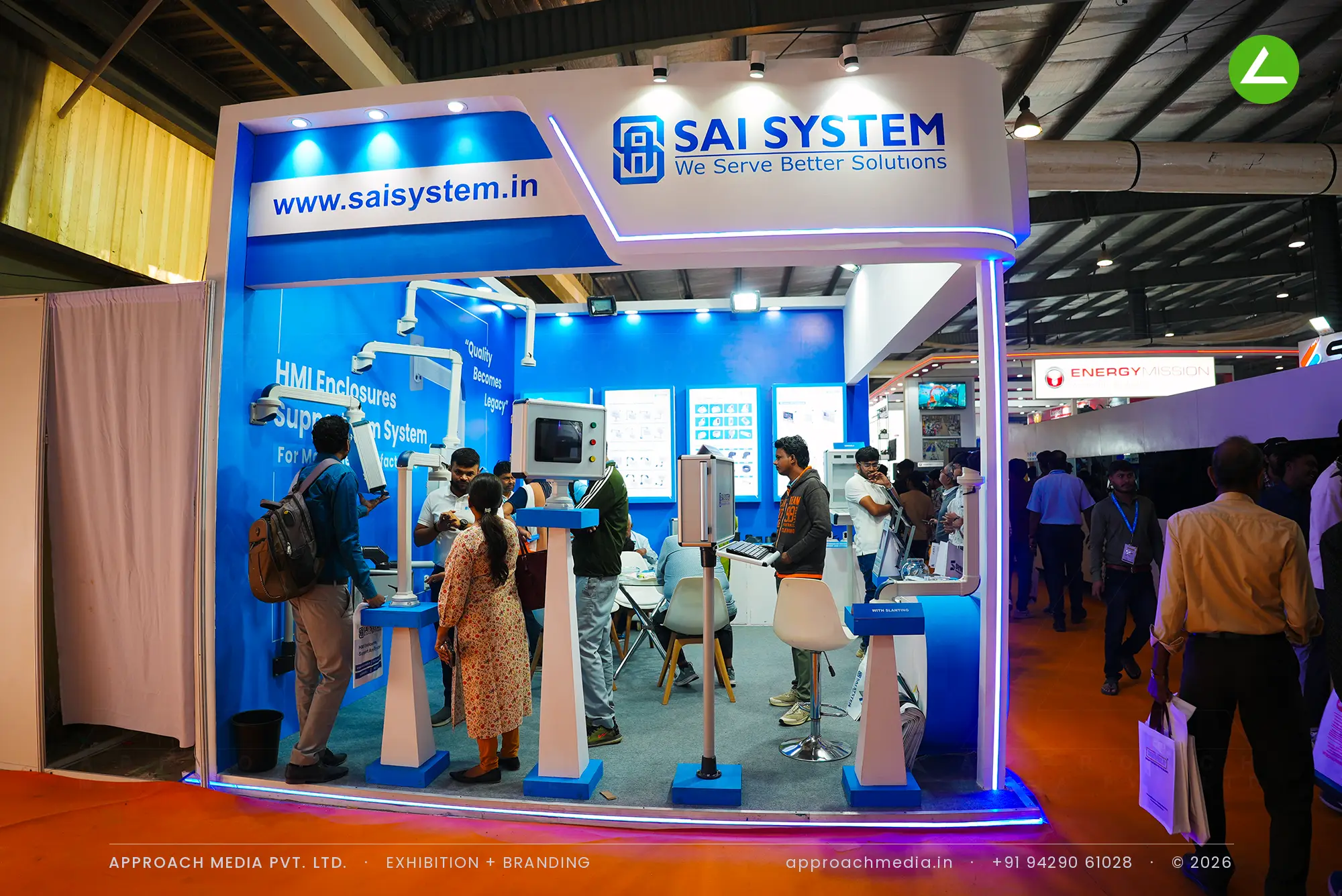 Sai System — blue exhibition stall design at EngiMach Gandhinagar with live support-arm demos — photo 2