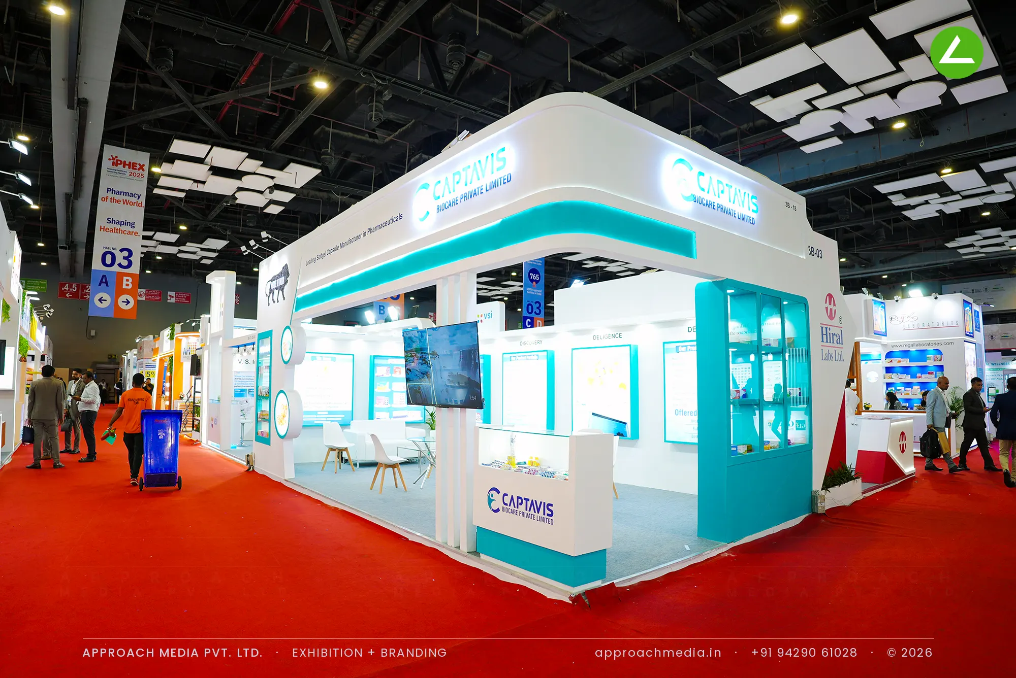 Captavis Biocare exhibition stall design at iPHEX New Delhi with teal glazed cabinets and a curved backlit fascia