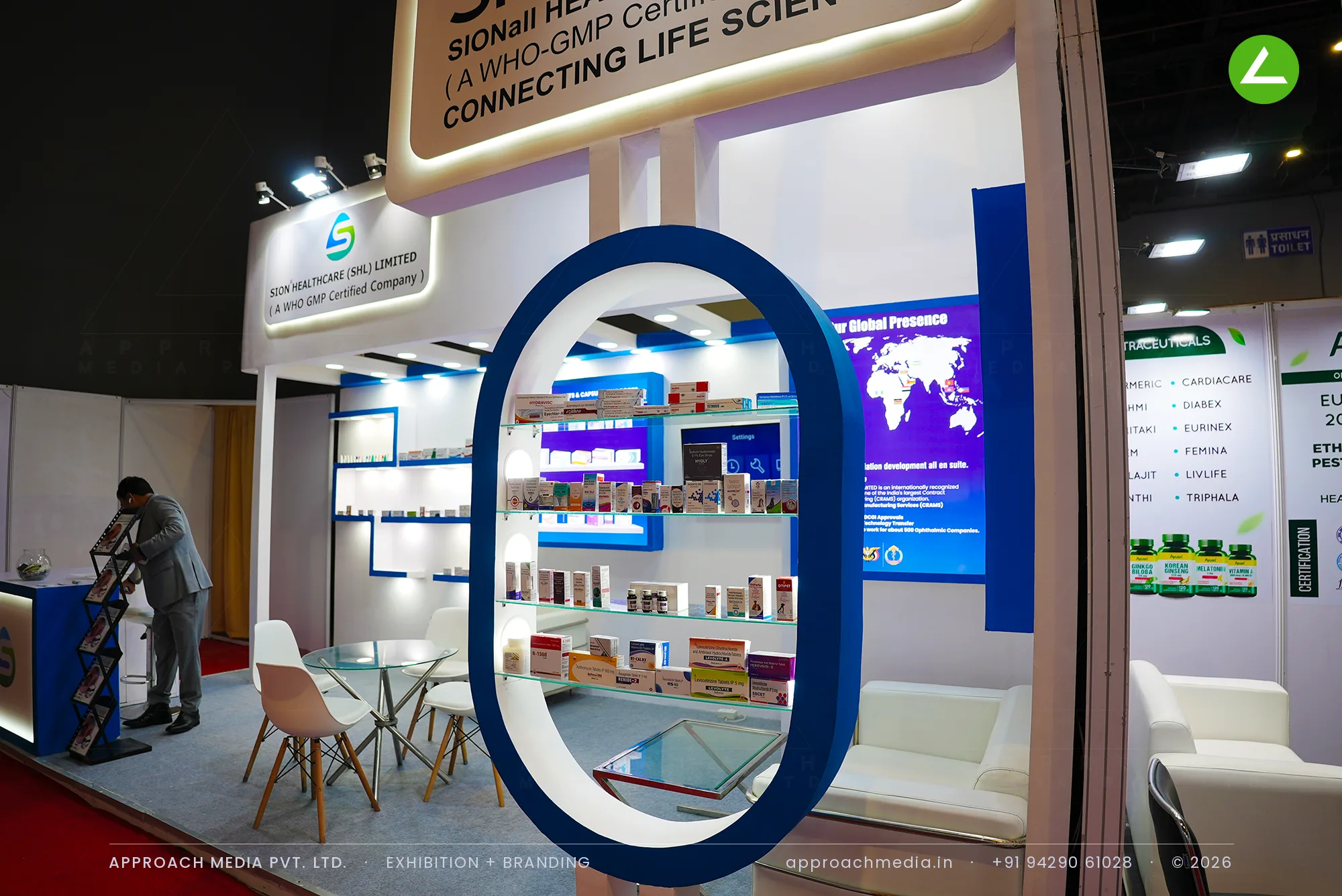 Sion Healthcare (SHL) Limited: Exhibition Stall Design at iPHEX New Delhi with a Blue Oval Frame — photo 4