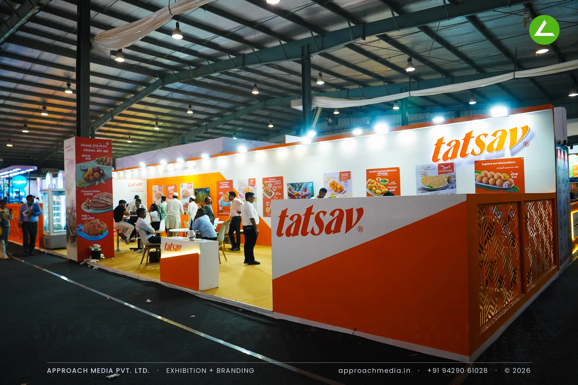 Tatsav 90 sqm exhibition stall design at Khadhya Khorak Expo Gandhinagar with orange perimeter and open lounge
