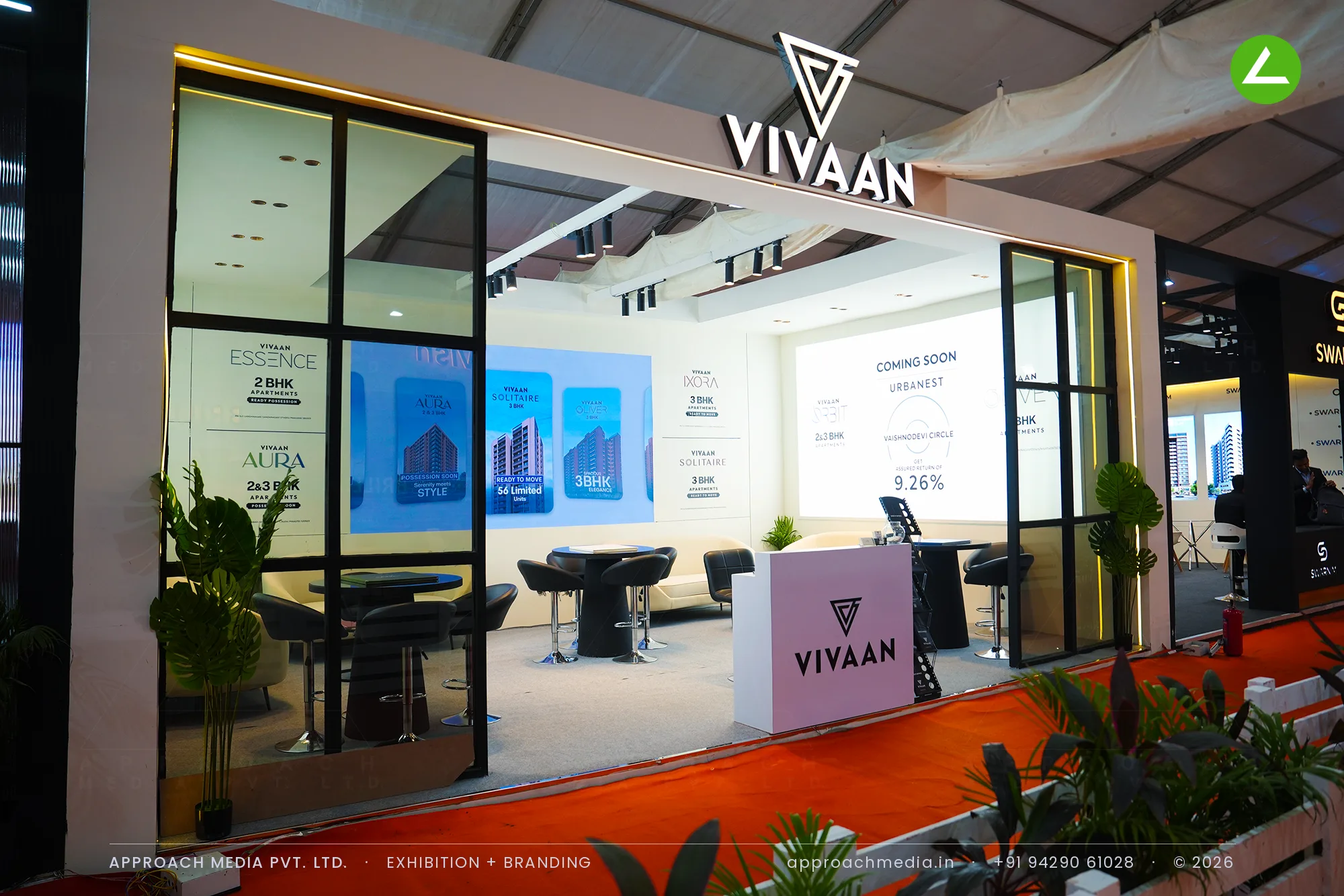 Vivaan at NAREDCO Property Expo Ahmedabad — a 48 sqm exhibition stall design in mocha and ivory — photo 2