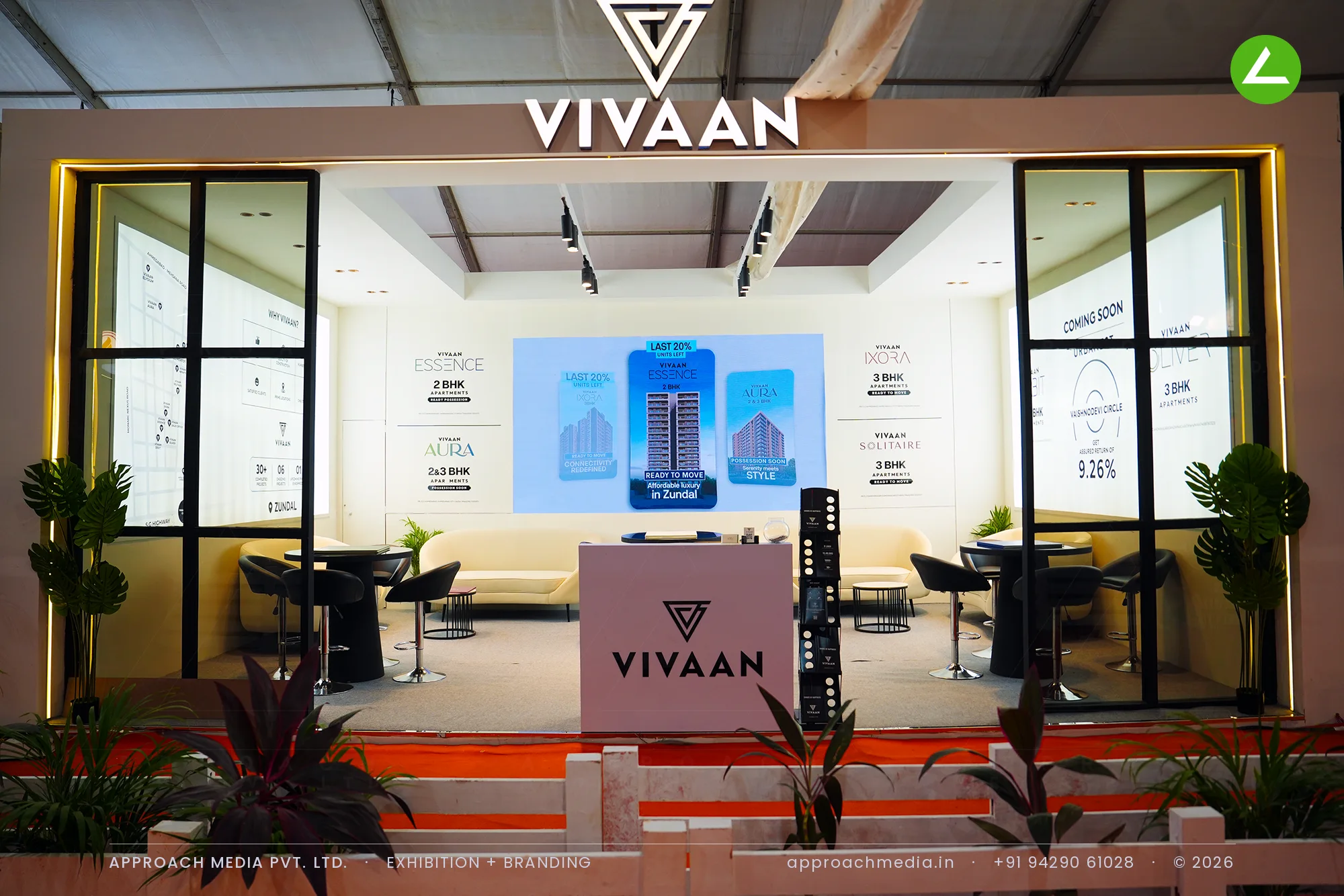 Vivaan exhibition stall design at NAREDCO Property Expo Ahmedabad with black grid glazing and ivory interior lounge