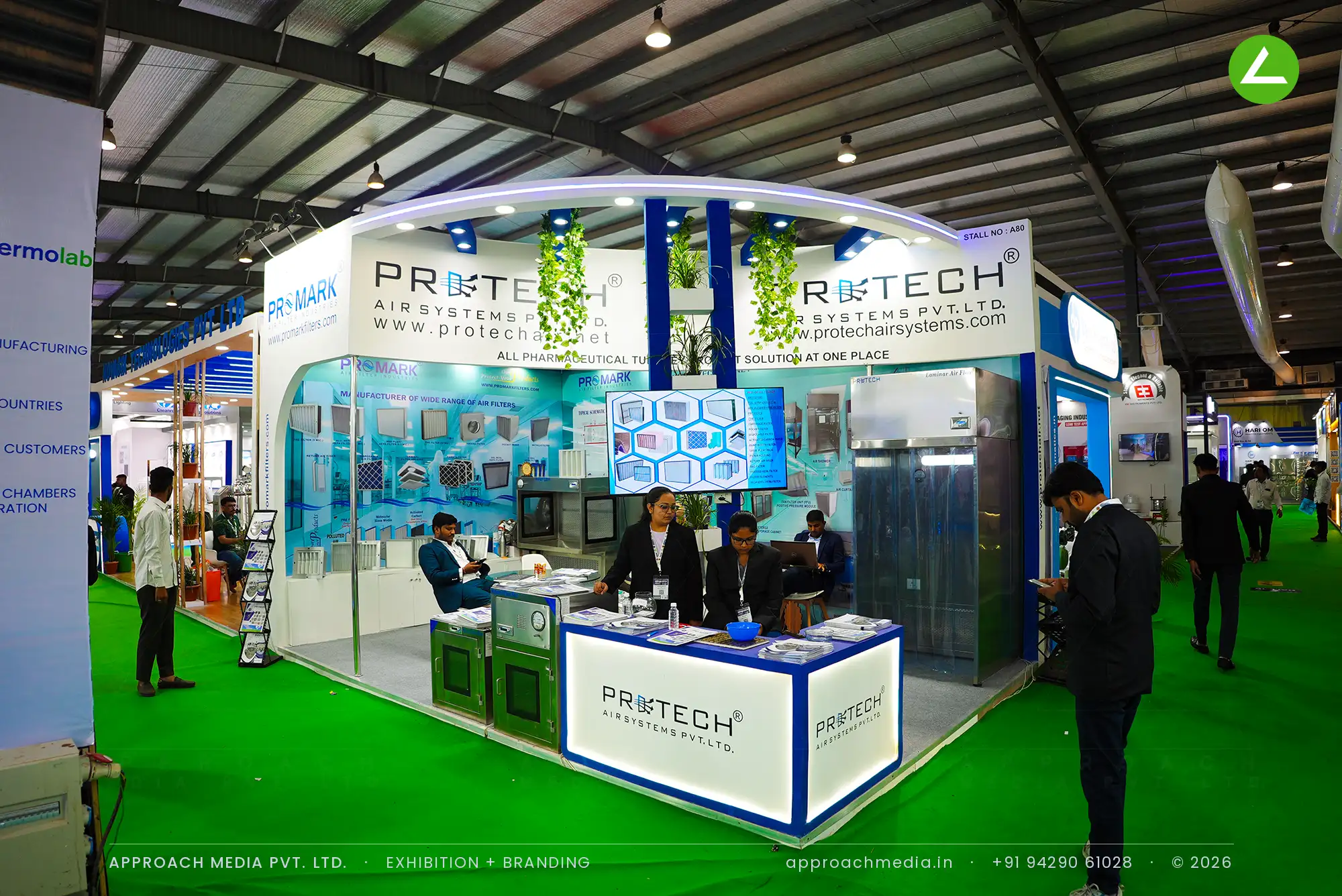 Protech Air Systems curved arch stall with blue columns, exhibition stall design at Pharmatech Expo Gandhinagar