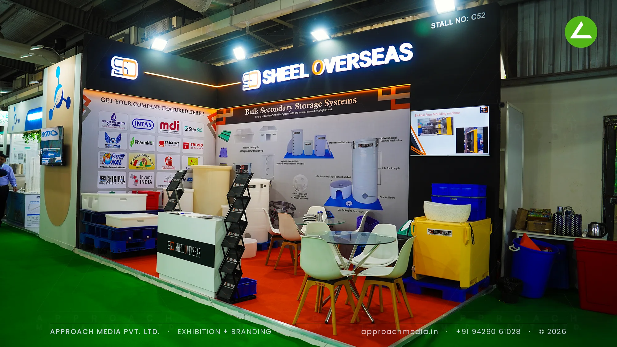 Sheel Overseas black fascia stall with storage tanks on red carpet, exhibition stall design at Pharmatech Expo Gandhinagar