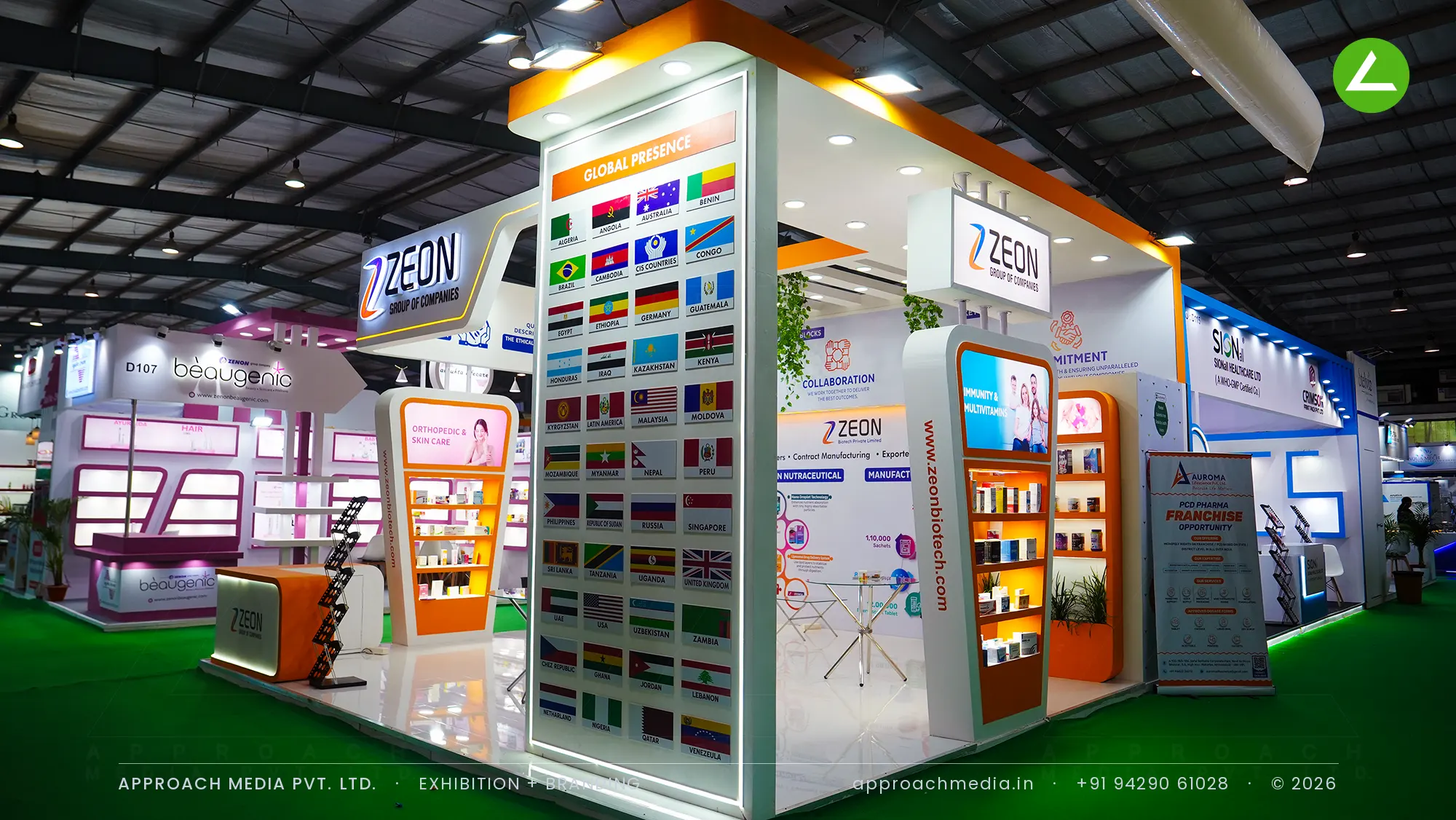Zeon Group stall with lit product towers and backlit flag column, exhibition stall design at Pharmatech Expo Gandhinagar