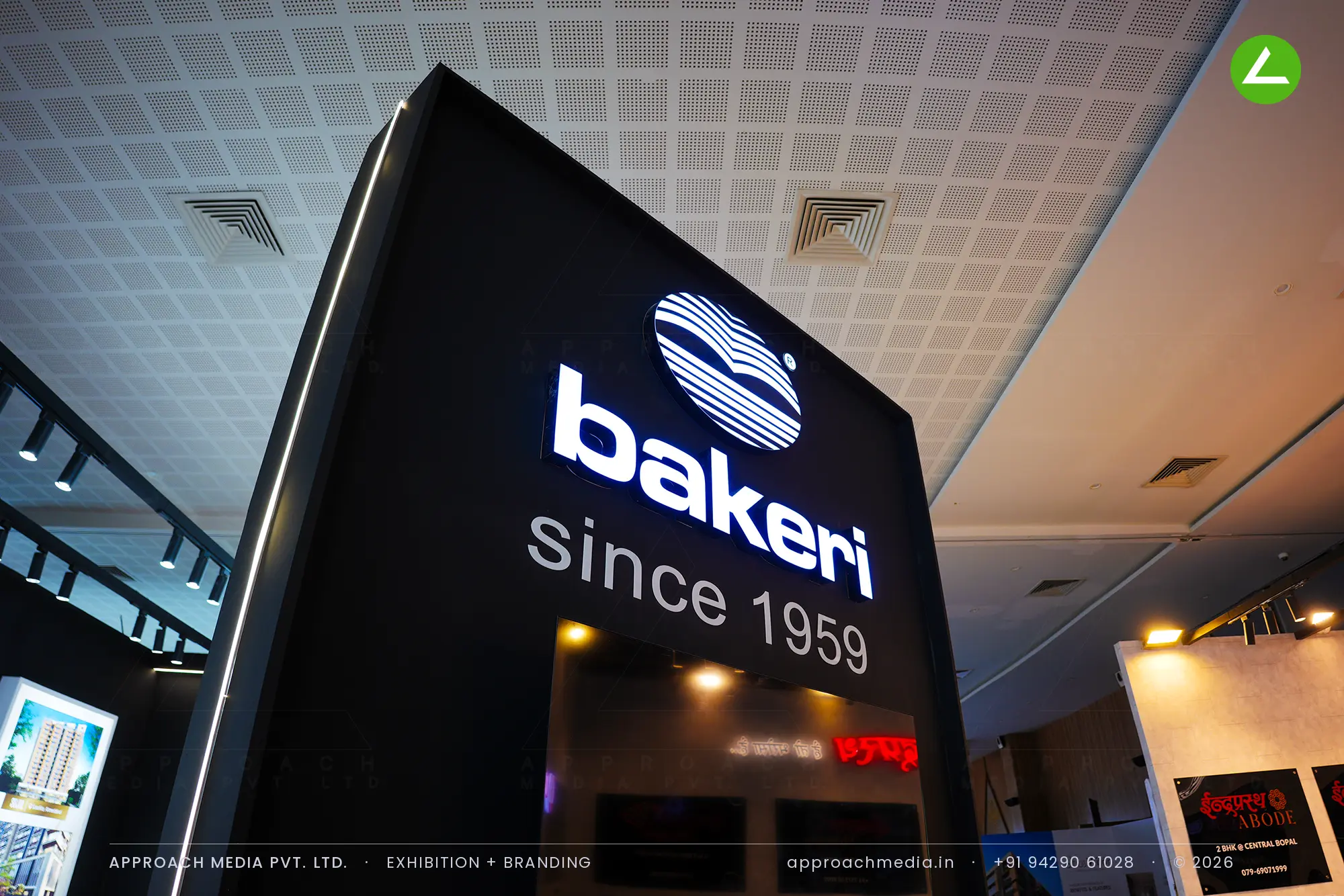 Bakeri's matte black 36 sqm exhibition stall design at Times Property Expo Ahmedabad — photo 4