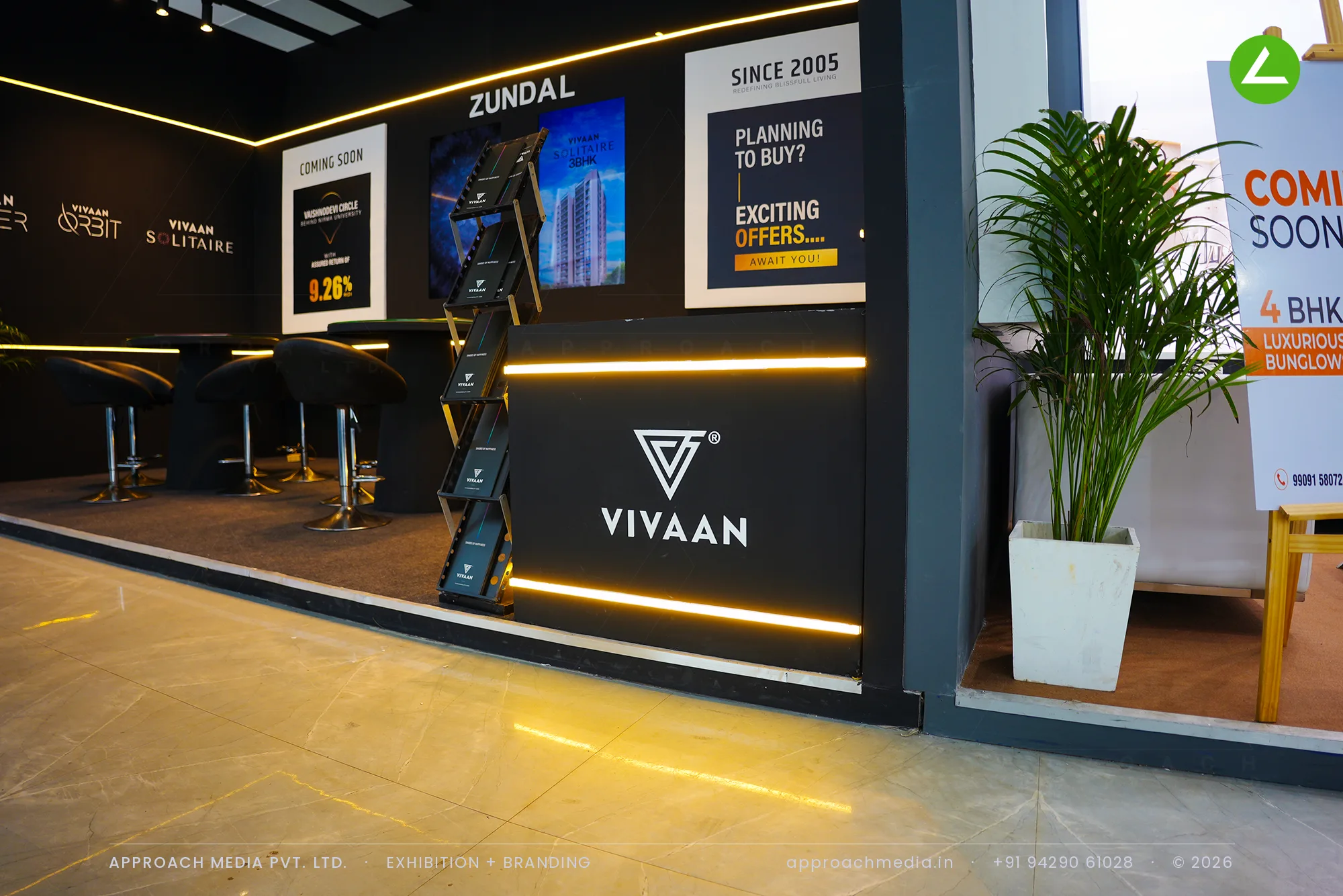 Vivaan at Times Property Expo Ahmedabad 2025 — Black-and-Gold Exhibition Stall Design — photo 4