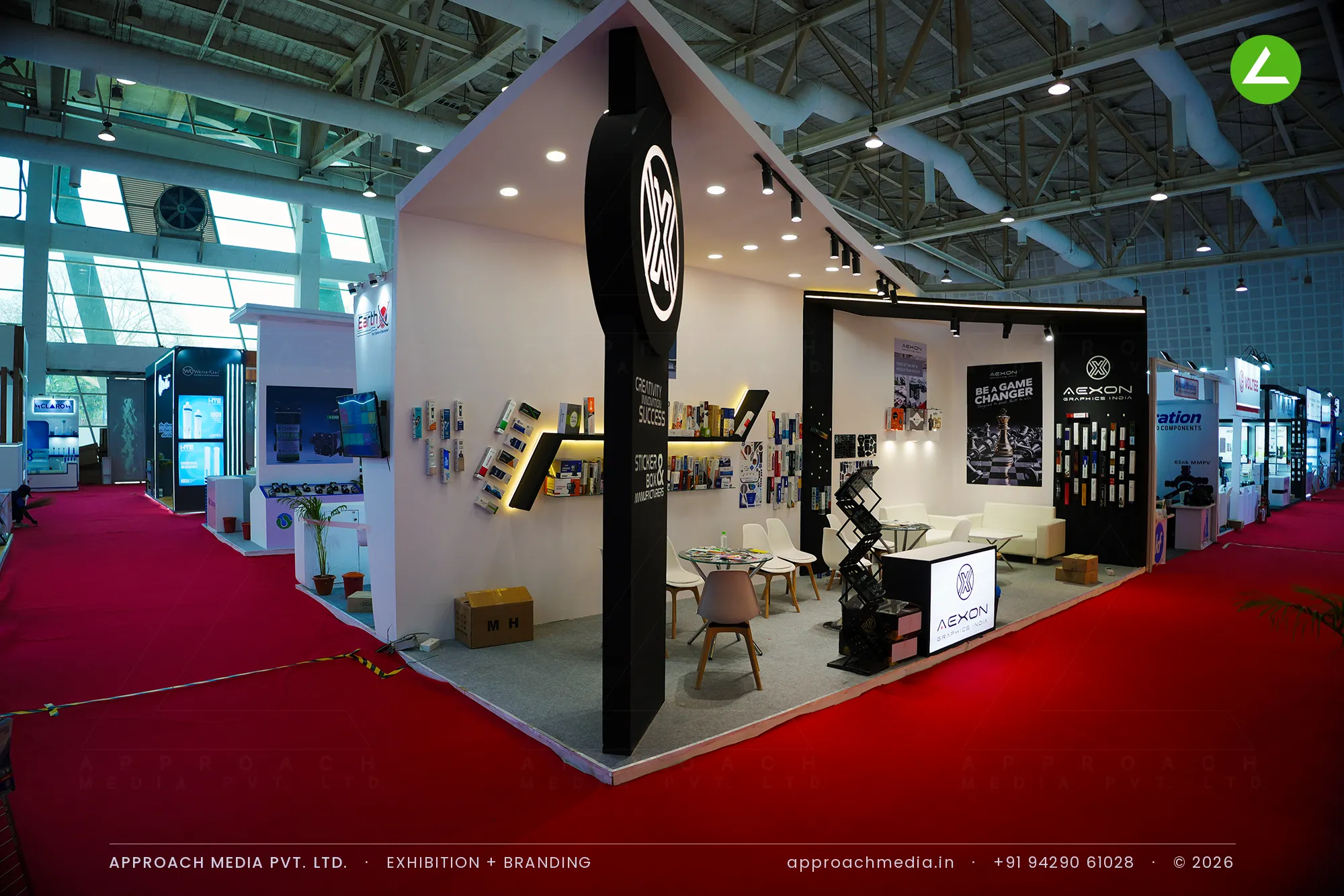 White Aexon exhibition stall design at WAPTAG Water Expo Gandhinagar with a black corner drum and backlit ring logo