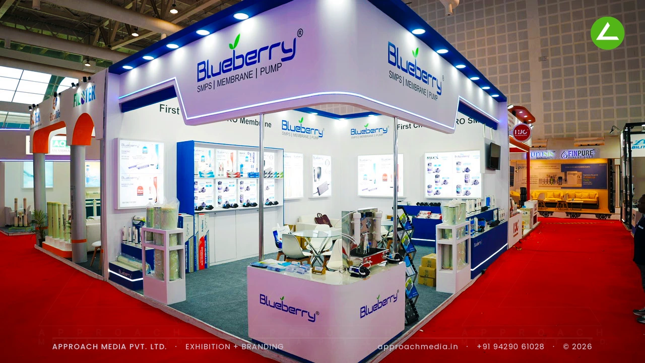 Blueberry exhibition stall design at WAPTAG Water Expo Gandhinagar with blue cove-lit fascia and backlit product walls