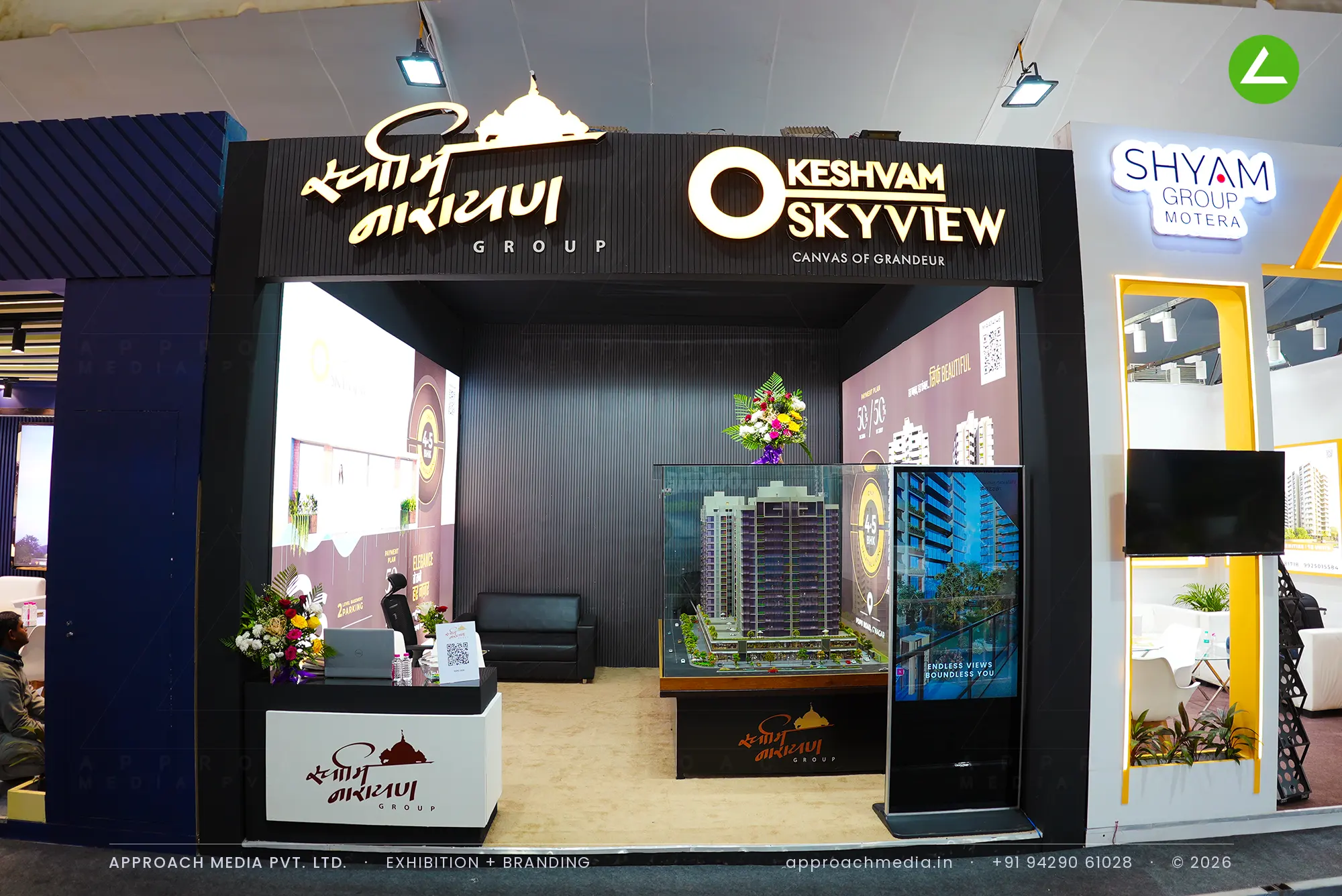 Keshvam Skyview exhibition stall design at Divya Bhaskar Property Expo Gandhinagar with lit fascia logo and tower model