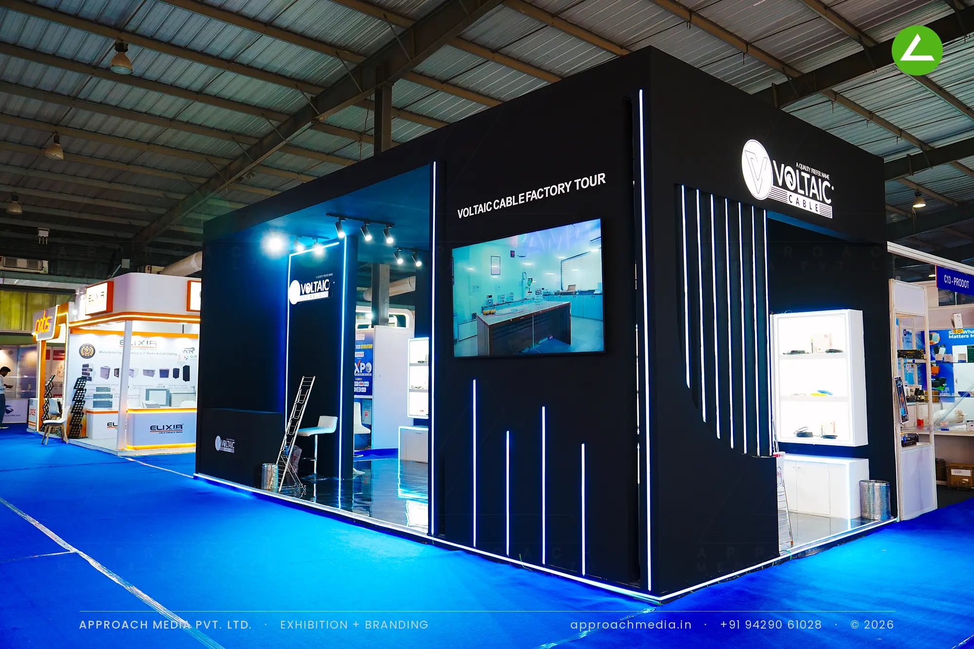 Voltaic Cable exhibition stall design at FITAG Tech Expo Gandhinagar: black walls, lit vitrines — photo 2