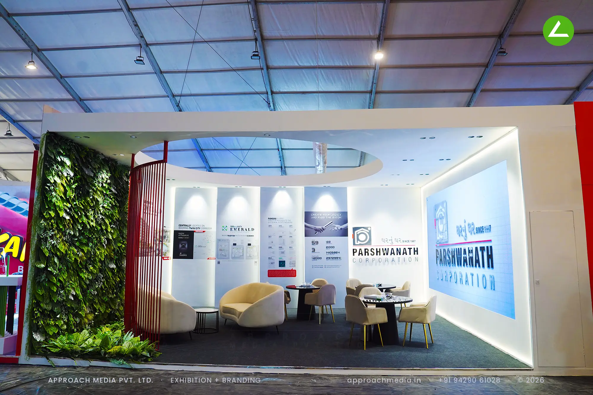 Parshwanath Corporation exhibition stall design at GIHED Property Show Ahmedabad with curved white walls and oval ceiling