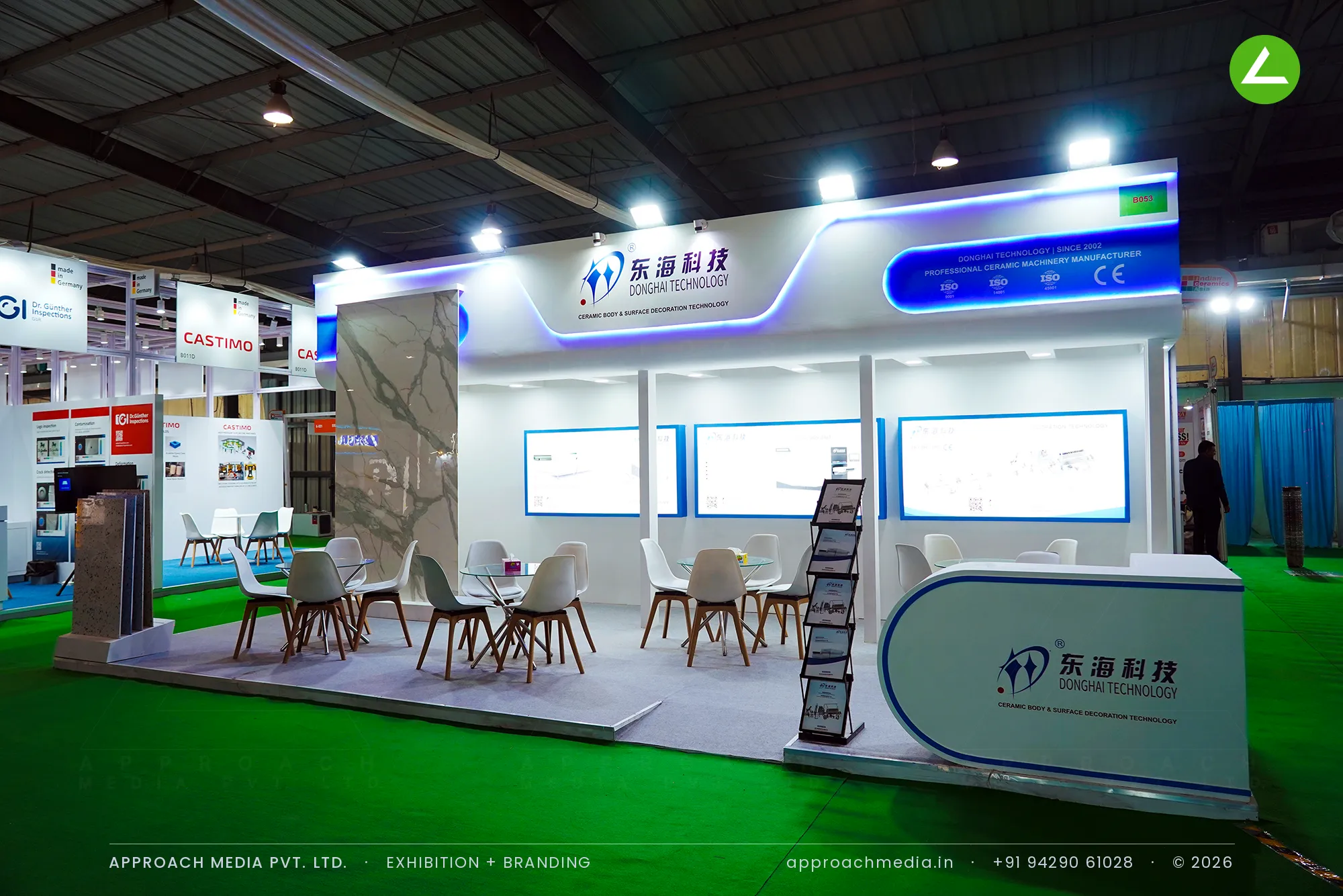 Donghai Technology exhibition stall design at Indian Ceramics Asia Gandhinagar, blue-lit fascia and backlit panels