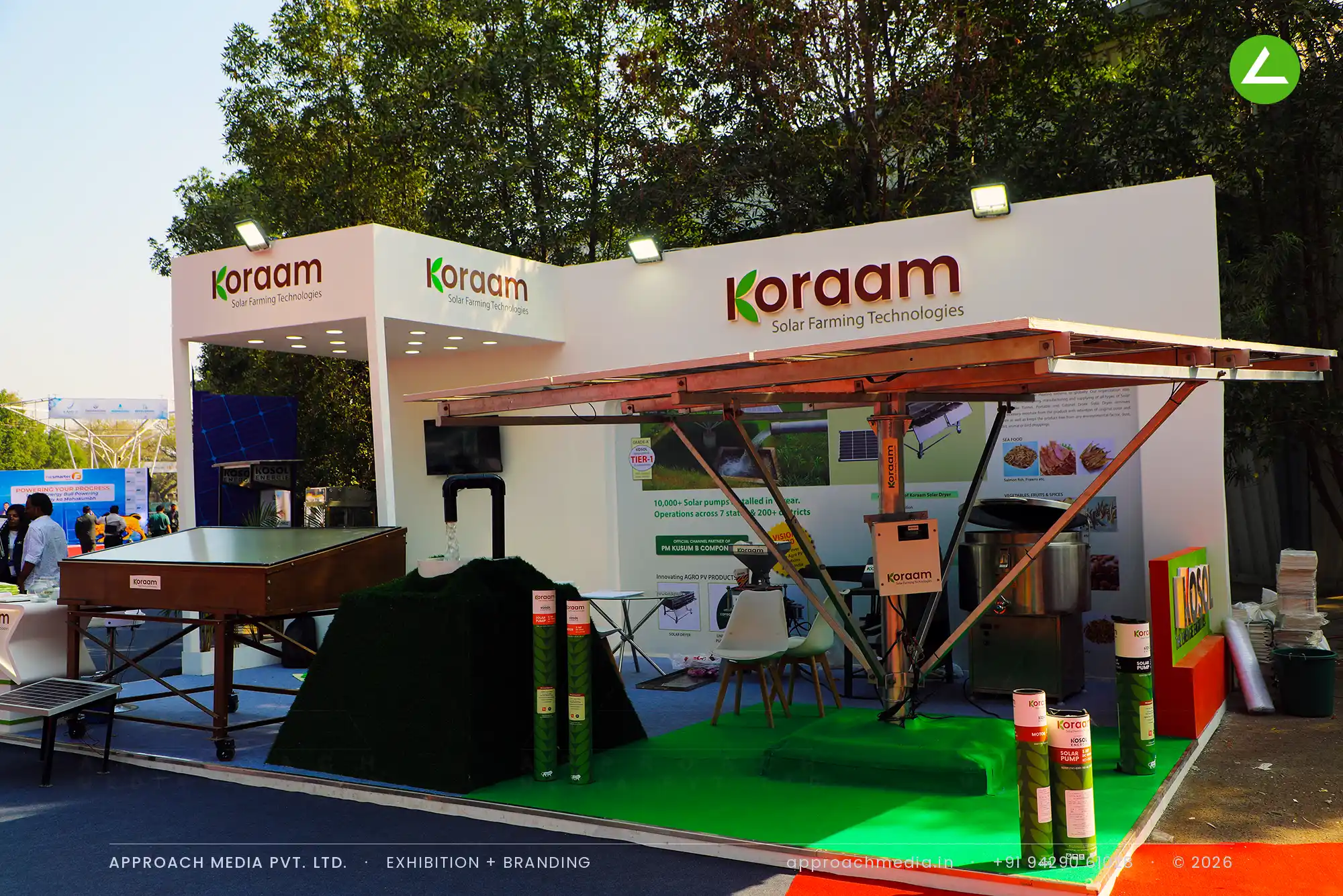 Koraam exhibition stall design at Intersolar India Gandhinagar, open-air canopy with solar pump and dryer equipment