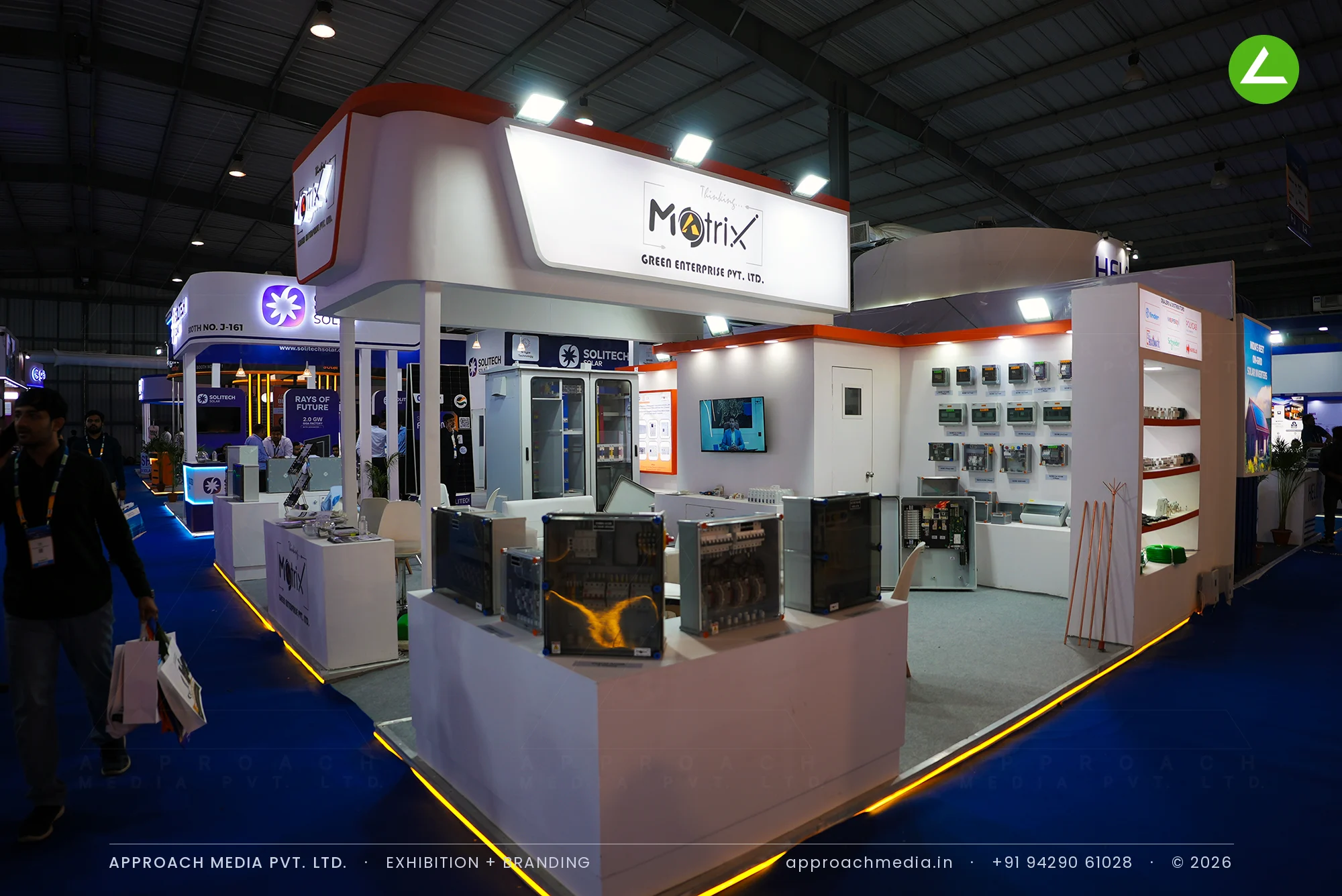 Matrix Green Enterprise white and orange exhibition stall design at Intersolar India Gandhinagar with lit control panels