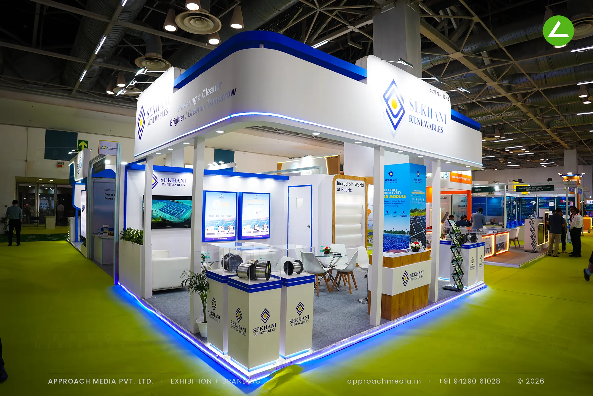 Exhibition stall design at REI Greater Noida: Sekhani Renewables white canopy stand edged in blue light